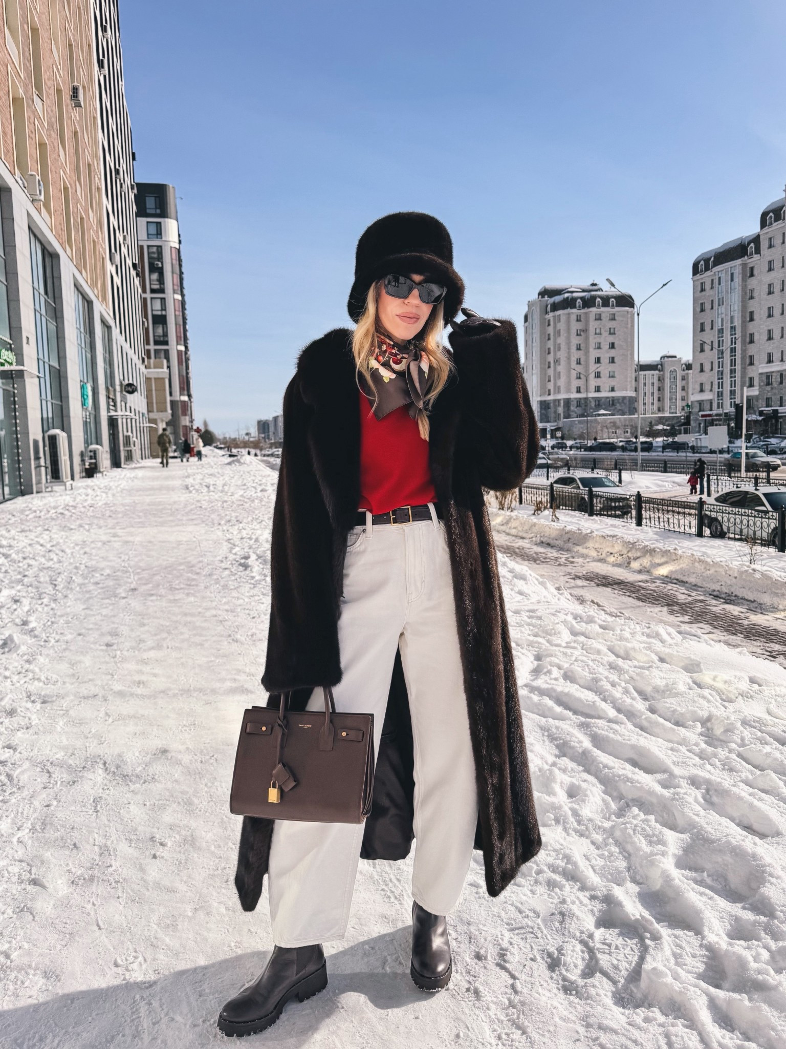 Chocolate brown fur coat, fur bucket hat, red sweater with white barrel jeans, silk scarf, red and chocolate brown outfit idea 

#LTKValentine #LTKSeasonal #LTKOver40