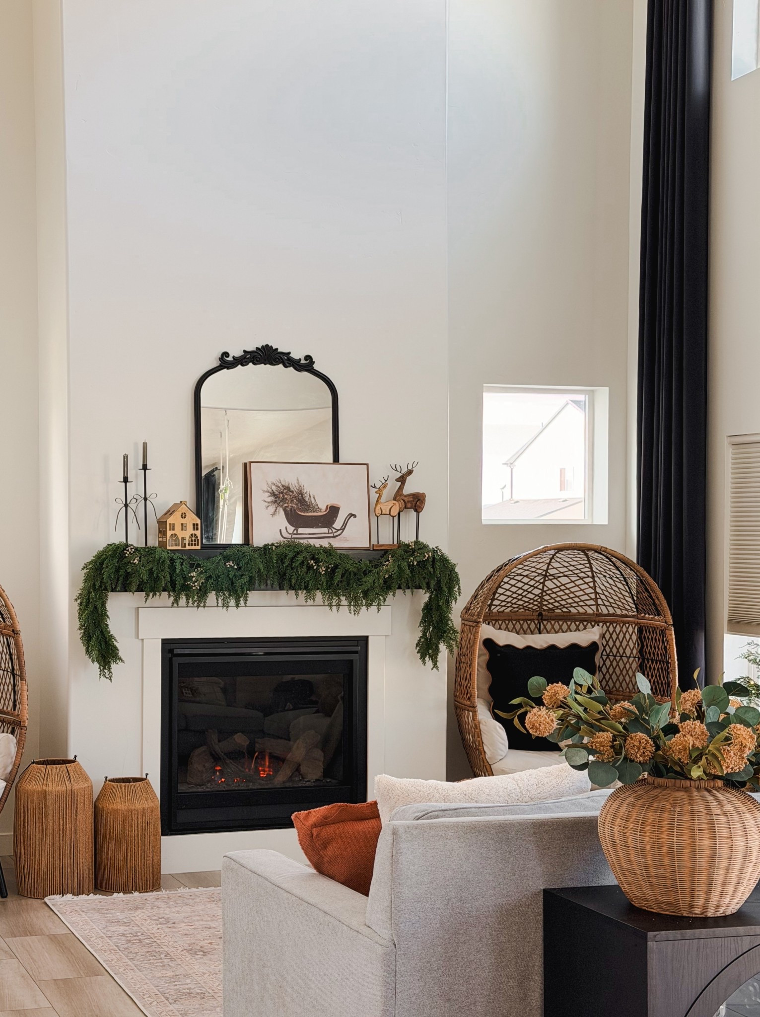 Modern, cozy Christmas corner vibes 🎄
The goal for my Christmas decor this year is warm, minimal magic without the clutter. I think the garland, black mirror, and woven accents create that perfect mix of modern and organic Christmas decor.

If you love neutral holiday styling, earthy Christmas decor, and natural textures, this setup is so easy to recreate!
I linked the rattan egg chair, wooden reindeer, cozy pillows, and vintage sleigh art print — and everything is so affordable !

#modernchristmasdecor #neutralchristmas #holidaymantel #ltkholiday #ltkhome #cozywinterdecor #earthychristmas #minimalchristmasstyle

#LTKFindsUnder50 #LTKHome #LTKHoliday