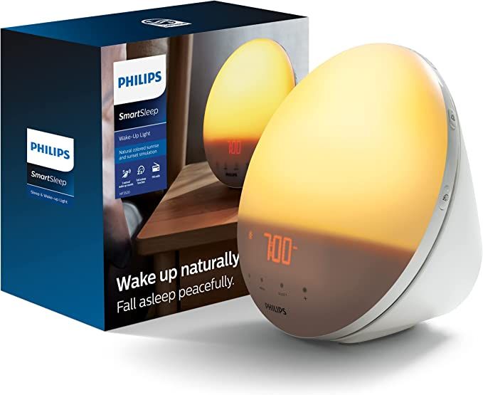 Philips SmartSleep Wake-up Light, Colored Sunrise and Sunset Simulation, 5 Natural Sounds, FM Rad... | Amazon (US)