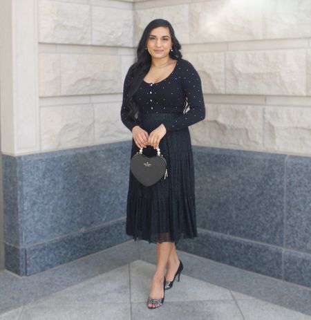 • Total Eclipse Of The Heart 🖤 •

This black heart bag with the pearl handle detail is SO chic and cute! I’ve linked a few places that you can still find them from as well as the new white version that came out recently! I’ve also linked similar styles to this adorable black rhinestone cardigan and metallic midi skirt! 🩶

You can shop my outfit by following me {sparkleandstyle} on the FREE LIKEtoKNOW.it app or via the Shop My Instagram link in my bio! 🤍

black outfit, black sweater cardigan, black midi skirt, black heart purse, rhinestone sweater, black tiered skirt, black heels, girly style, girly fashion, girly outfits, feminine style, feminine fashion 

#LTKstyletip #LTKfindsunder100 #LTKitbag