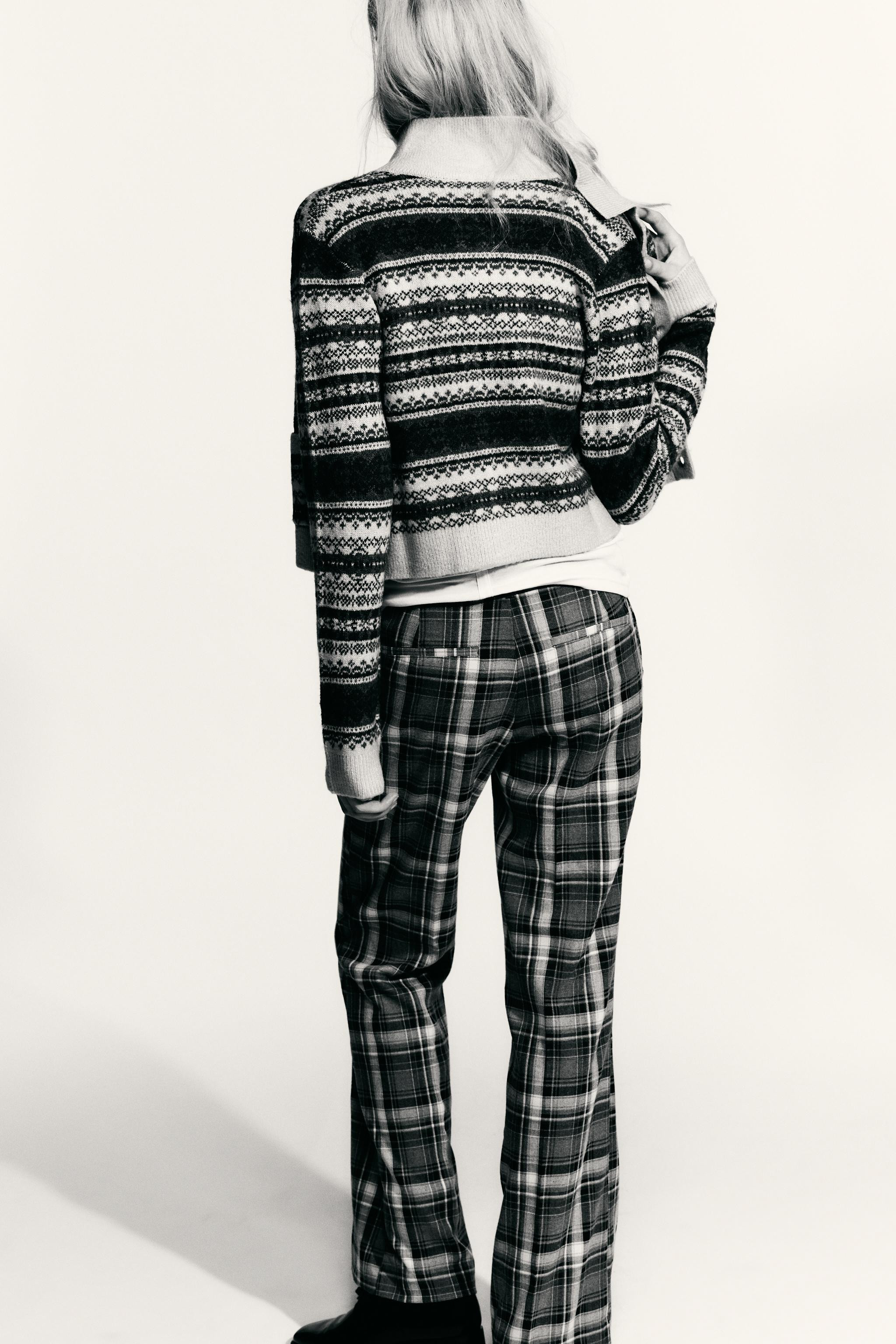 Round neck, long sleeve cardigan. Asymmetrical hem. Front button closure. | Zara US