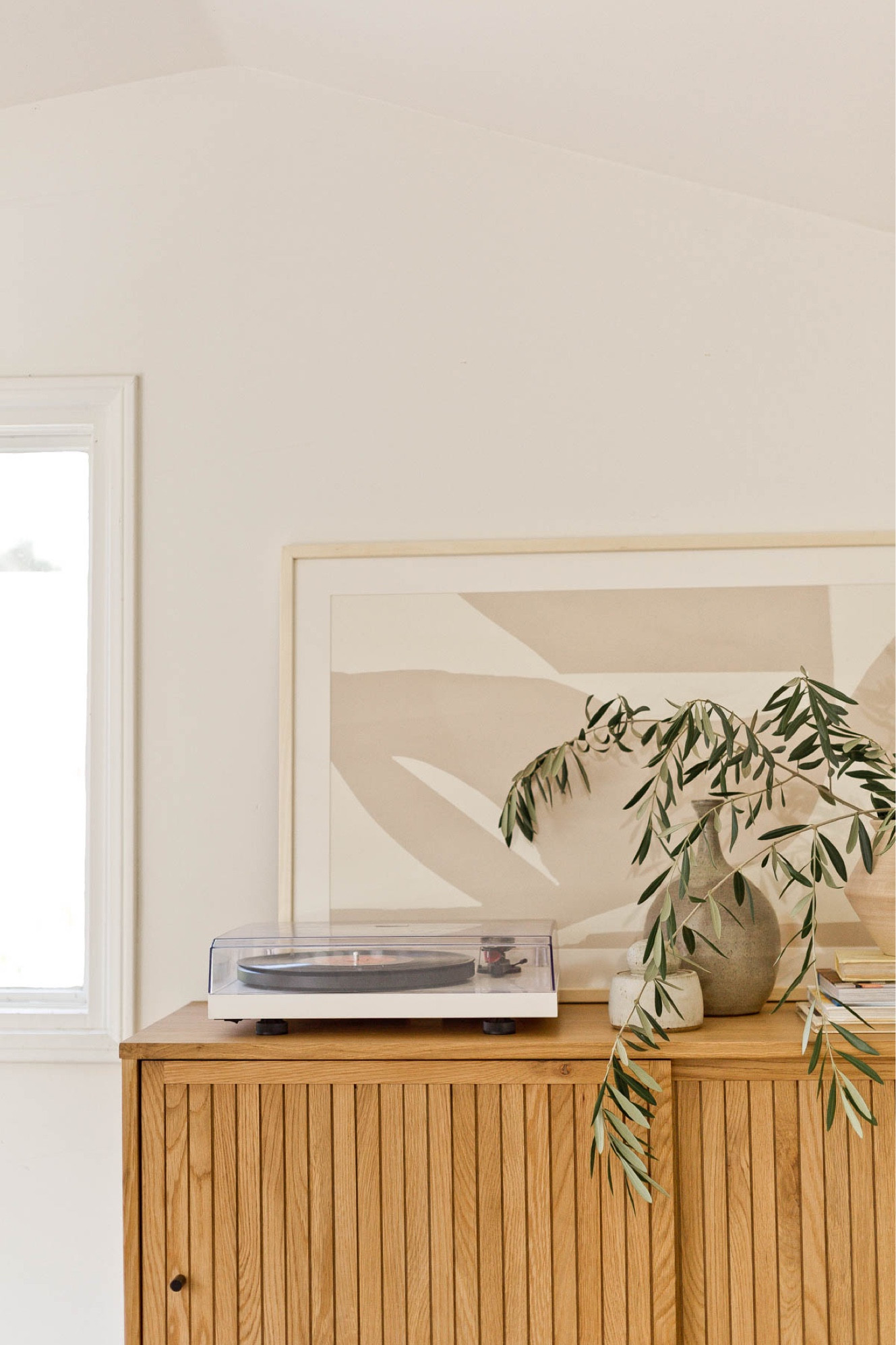 Used a bar cabinet as a record player cabinet and it worked perfectly. All the records are behind the closed doors of the cabinet. Record player - bar cabinet - bar cart - wood furniture - neutral artwork - living room - bedroom - organic modern

#LTKhome #LTKFind