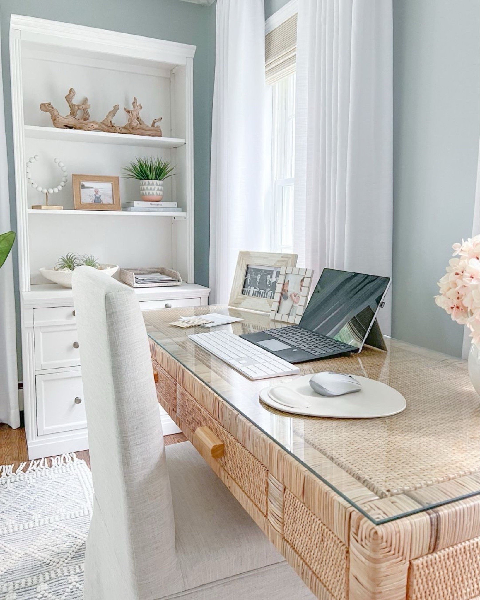 Home office views! I love working in here in the mornings when the sun is streaming through the windows. Desk no longer available but linking a very similar one from Amazon!
-
Home office, office furniture, office rug, coastal home decor, neutral home decor, neutral furniture, coastal desk, rattan desk, woven desk, large rug, faux plant, home office desk, natural desk, beach home style, beach style, coastal style, amazon home decor, bookshelf styling ideas, bookshelf decor, white bookcases, white shelves, white file cabinet, white home office furniture, pottery barn shelves, woven shades, woven blinds, window treatments, driftwood branch, coastal coffee table books, amazon coffee table books, decorative objects, shelf accessories, planters, decorative bowls, bowl filler, picture frames, amazon desks, white curtains, white drapes, amazon curtains, amazon drapes, white vases, amazon vases, office organization, black curtain rod, amazon chandelier, white beaded chandelier, blue & white rugs, coastal rugs, rugs with fringe, textured rugs, 8x10 rugs, 5x8 rugs, 6x9 rugs, desk chairs 

#LTKHome #LTKFindsUnder50 #LTKFindsUnder100