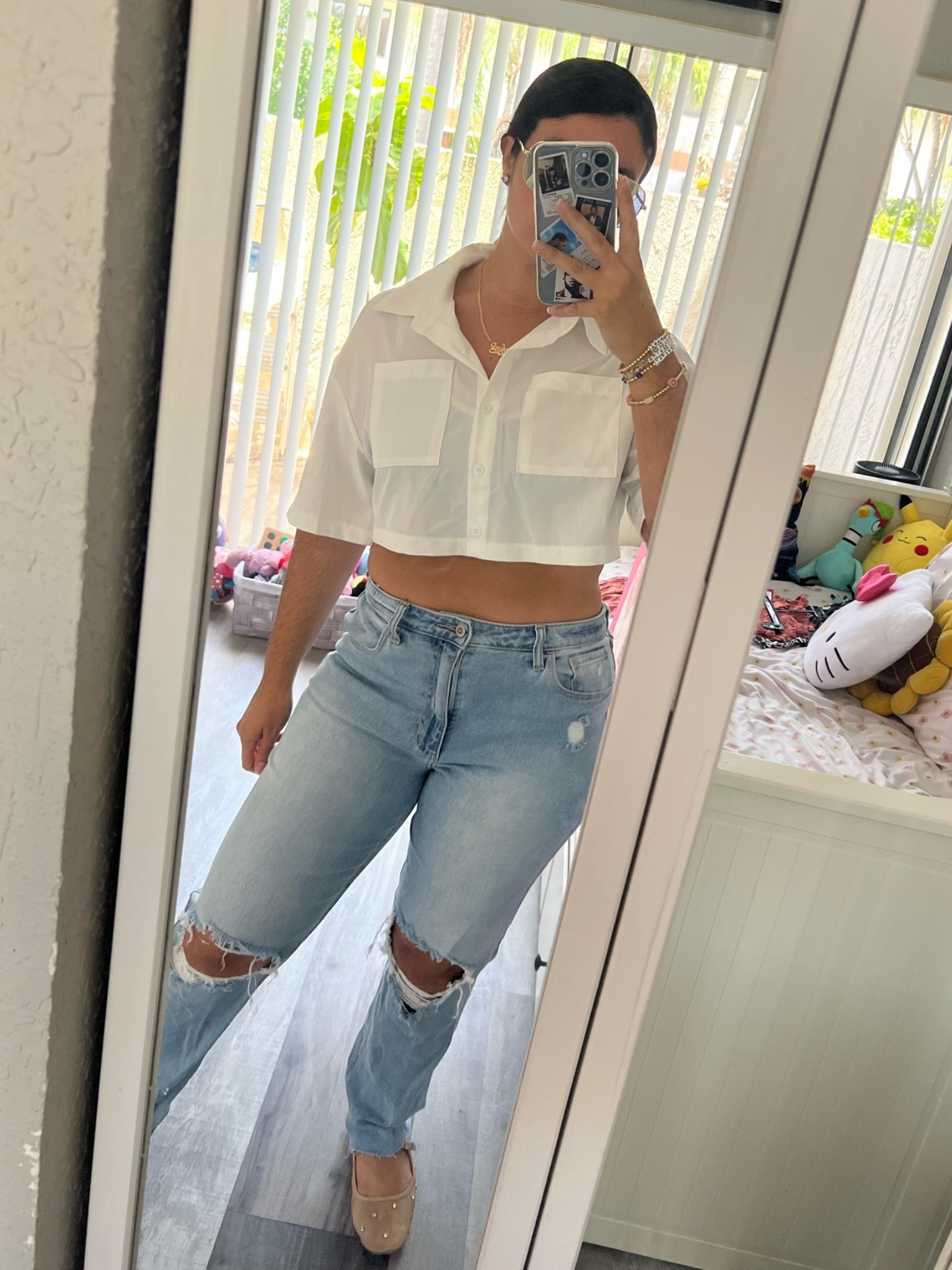 White cropped top - high waisted jeans - studded flats

#LTKSaleAlert #LTKootd #LTKMidsize