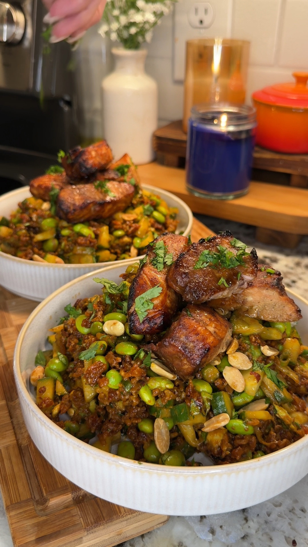 we are SO obsessed with this chili peanut crispy rice salad! paired with my honey soy salmon bites- I could eat it everyday🥜🌿🌶️🍚

packed full of green veggies & tossed with a drool worthy creamy chili peanut dressing, you have got to try this!

Ingredients:

rice
- 1.5 cups day old jasmine rice
- 2 tbsp white vinegar
- 1 tsp sesame oil
- 1 tbsp granulated white sugar
- 1/4 cup fried chili in oil
*bake at 400°F for 40 minutes stirring every 10 minutes until brown and crispy

salmon
- about 1 lb salmon filet, cut into cubes
- 1/4 cup soy sauce
- 2 tbsp honey
- 1 tsp sesame oil
- 1 tsp onion powder
- 1 tsp garlic powder
- 1/2 tsp salt
- 1 tsp pepper
*marinate for at least 10 minutes then air fry at 400°F for 10 minutes

dressing
- 1/3 cup soy sauce
- 1 heaping tbsp honey
- 1 heaping tbsp creamy peanut butter
- 1 tbsp fried chili in oil
- 2 tbsp white vinegar
- 1 tsp onion powder
- 1 tsp garlic powder
*blend

- 1.5 large English cucumbers, diced & dried
- 1 cup edamame
- 1/3 cup green onion, chopped
- 1/4 cup cilantro, chopped
- 1 large avocado, cubed & sprinkled with salt & pepper
- handful peanuts

#LTKHome #LTKFamily #LTKSeasonal