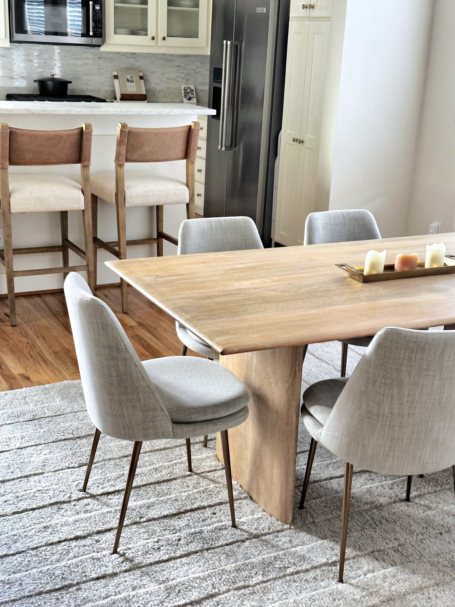 Neutral dining nook perfection ✨ Loving the mix of warm wood, soft gray tones, and leather details — cozy yet modern.
Dining table + chairs are West Elm, barstools are also west elm 
#HomeDecor #NeutralHome #DiningRoomInspo #ModernCozy #LTKHome #LTKFinds #HomeStyle

#LTKStyleTip #LTKHome