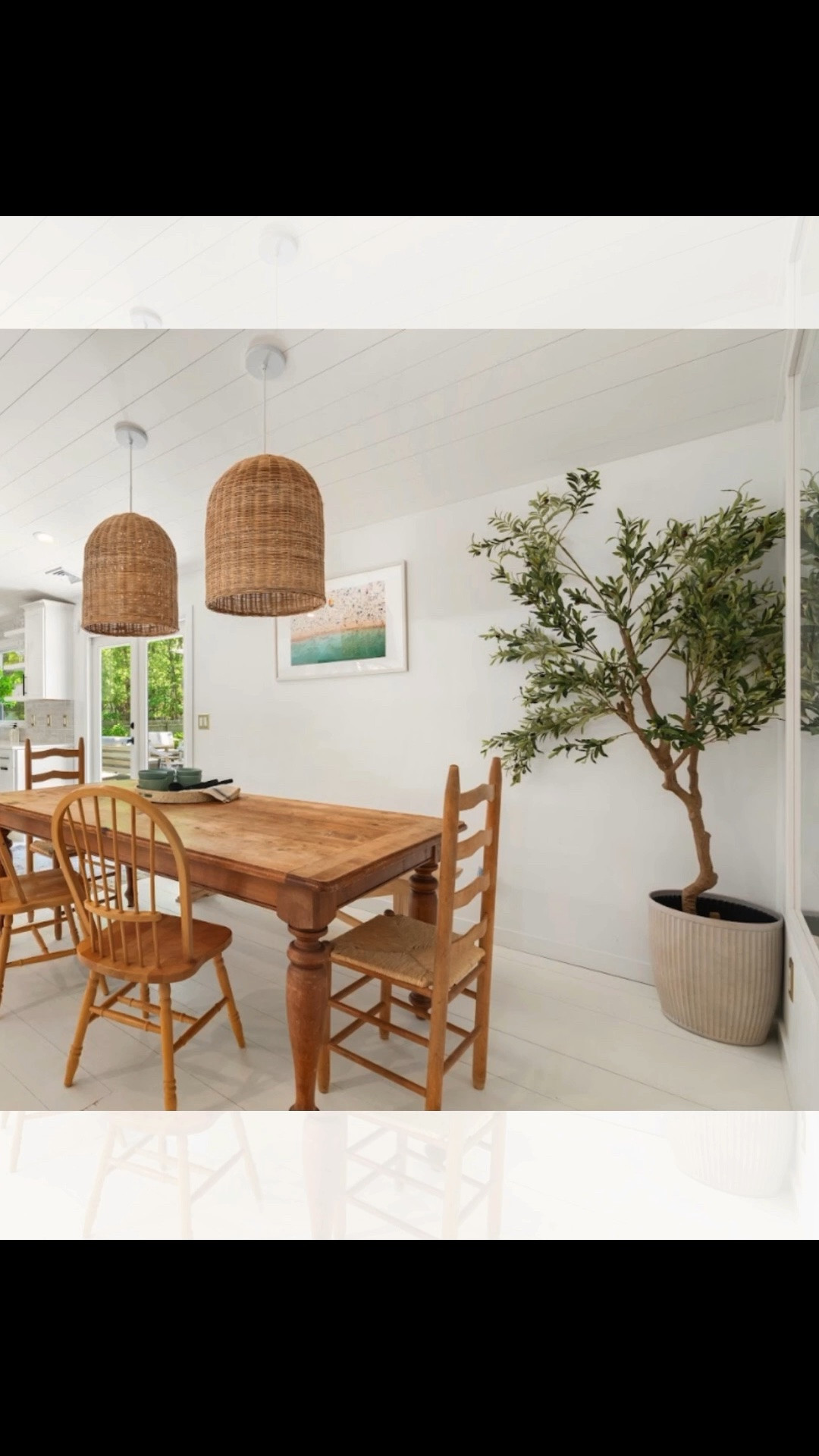 Wood dining table, mixed wood dining chairs, woven pendants, and a large olive tree layered into this dining space. This space located directly off the kitchen, we paired natural materials, white walls, and warm wood tones throughout. Linked exact and similar pieces below.

#LTKHome #LTKSaleAlert