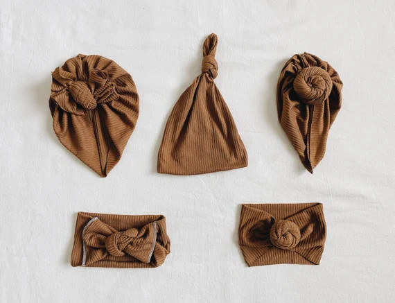 Read the full title
    Tan ribbed, baby turban, baby hat, knot headband, knot hat, baby beanie, ... | Etsy (US)