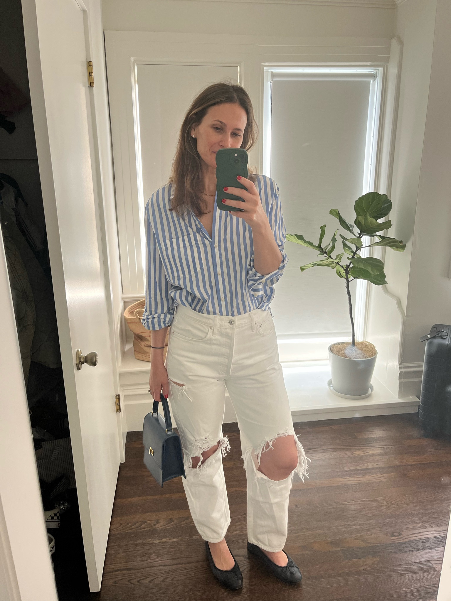 Balancing act—ripped jeans, polished bag + button down for lunch 

#LTKSeasonal #LTKstyletip