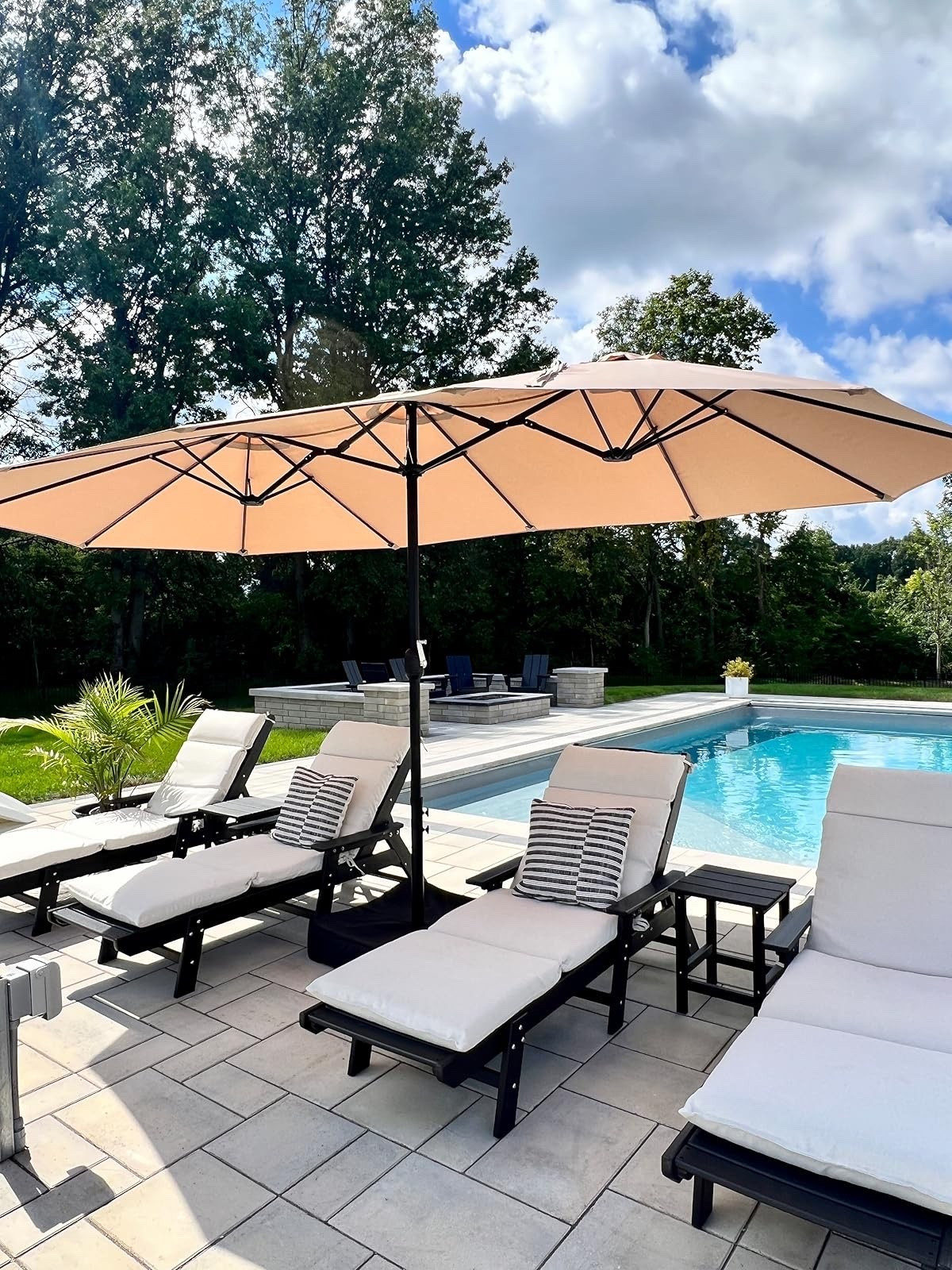 Enjoy your outdoor space with these stylish lounge chairs and umbrellas. Perfect for poolside lounging. #outdoorliving #patiofurniture

#LTKSeasonal #LTKHome