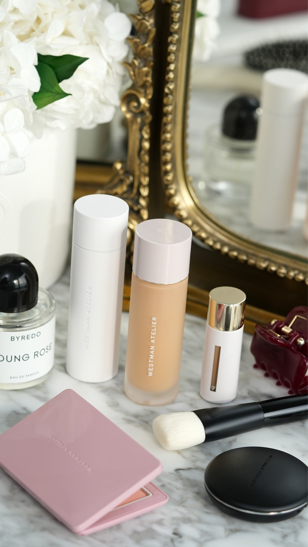 Testing the new @westmanatelier Suprême Bio-Complex Liquid Foundation! It has a satin finish with medium to full coverage and blends into the skin easily.

I’m in between shades M4 (medium warm) and T1 (medium to tan olive) right now, so I applied M4 on one side and T1 on the other for a side-by-side comparison.

For reference, I have normal skin with some dry patches. I prepped with the Westman Atelier Skin Activator Serum + @bobbibrown Vitamin Enriched Face Base for a smoother application.

Put this formula to the test with the new Westman Atelier Liquid Foundation Brush and my @hourglasscosmetics Ambient Soft Glow Foundation Brush. The new WA brush is nice, but not a must-have for me.

So far it seems to hold up really well in Miami humidity when I set it with powder. Even with some sweating, the foundation stays put on my skin. I think it's best suited for normal or combination skin but it still works well for me!

Which shade do you think works best: M4 or T1?