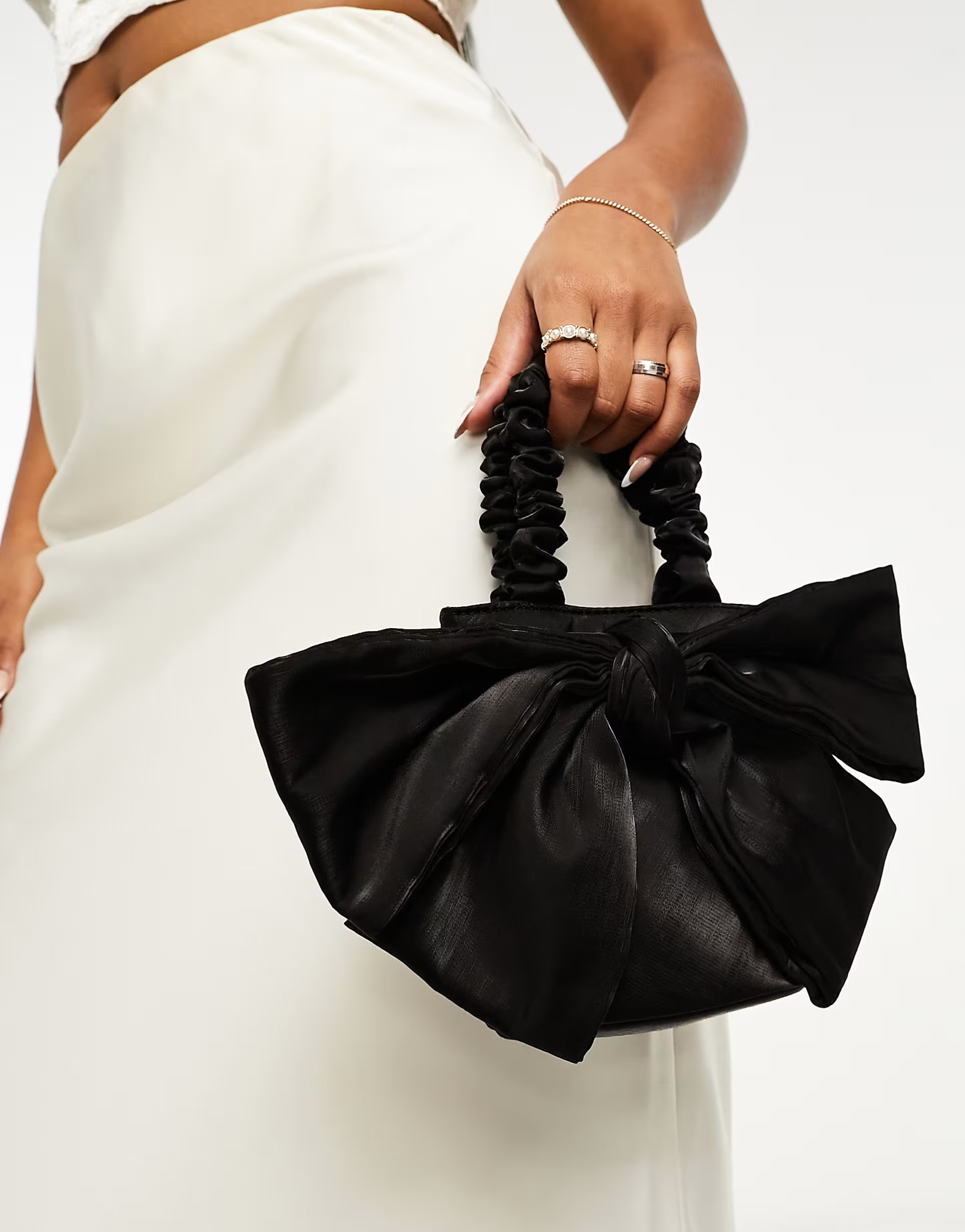 ASOS DESIGN oversized bow grab clutch bag in black | ASOS (Global)