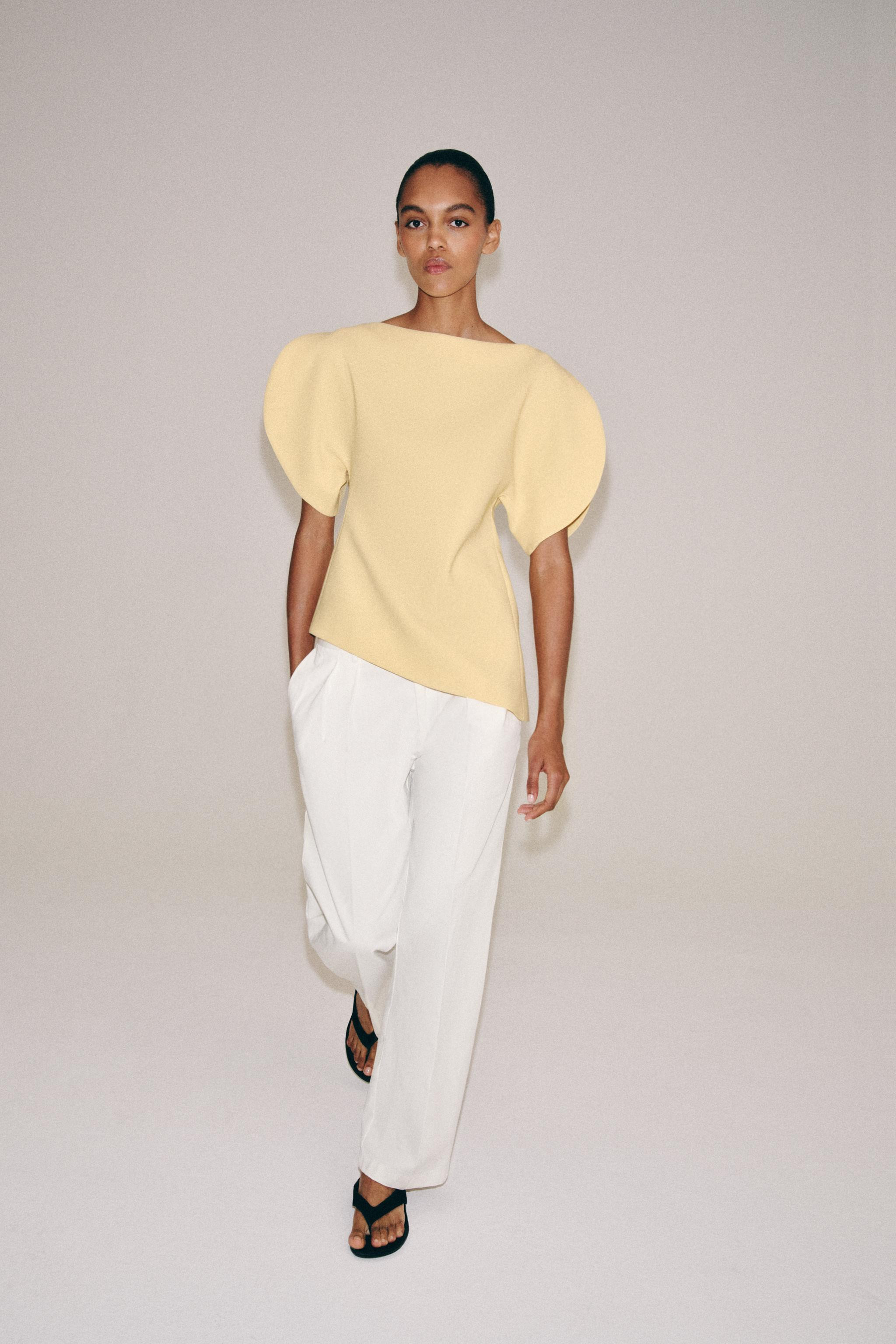 ZARA WOMAN COLLECTIONBoat neck top with puff sleeves and vents. Asymmetric hem. Back hidden in-se... | Zara US