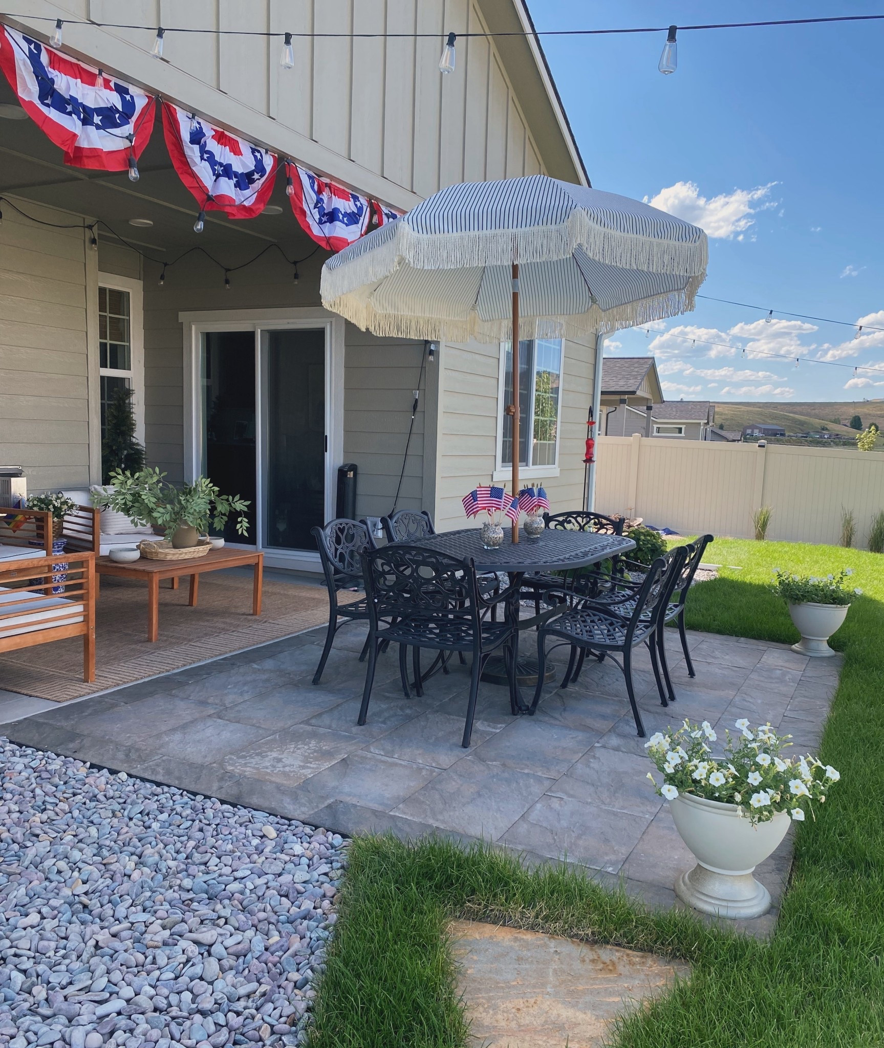 4th of July backyard patio summer decor and furniture 



Bunting flags hung from patio from valley_home Jadyn Hvass interior and exterior decor. Summer 4th of july decor with USA american flags dinner party

#LTKSeasonal #LTKHome