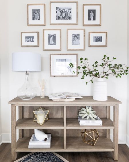 The perfect family console table and beautiful gallery wall. There are some huge deals in this pic! Including the lamp and area rug! Classic, light and bright  

#LTKhome #LTKfamily #LTKsalealert