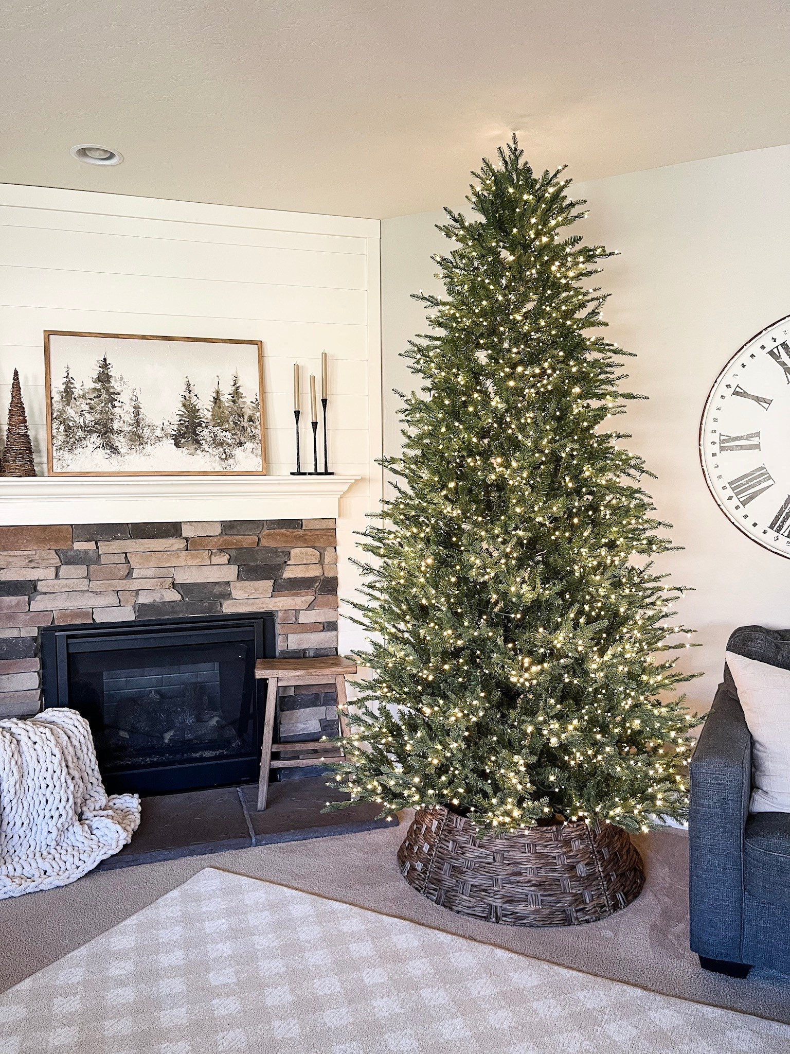 Twinkling balsam fir tree!
Follow @lifeinmyarizonahome on Instagram for more holiday ideas and inspiration. 

I set up the Grand Duchess twinkling tree - this is the full 9 foot version.  I have the full 7.5 foot version upstairs. This is the third year of having this tree and we still absolutely love it!  
I pushed the couch over to make some space, added this beautiful woven tree collar, and had everything set up very quickly.  The twinkling glow is pure holiday magic!  I highly recommend this tree if you’re looking for one that’s beautiful, realistic, and so easy to set up!

#christmastree #twinklingtree #holidaydecor #christmasdecor #homedecor 

#LTKSeasonal #LTKHome #LTKHoliday