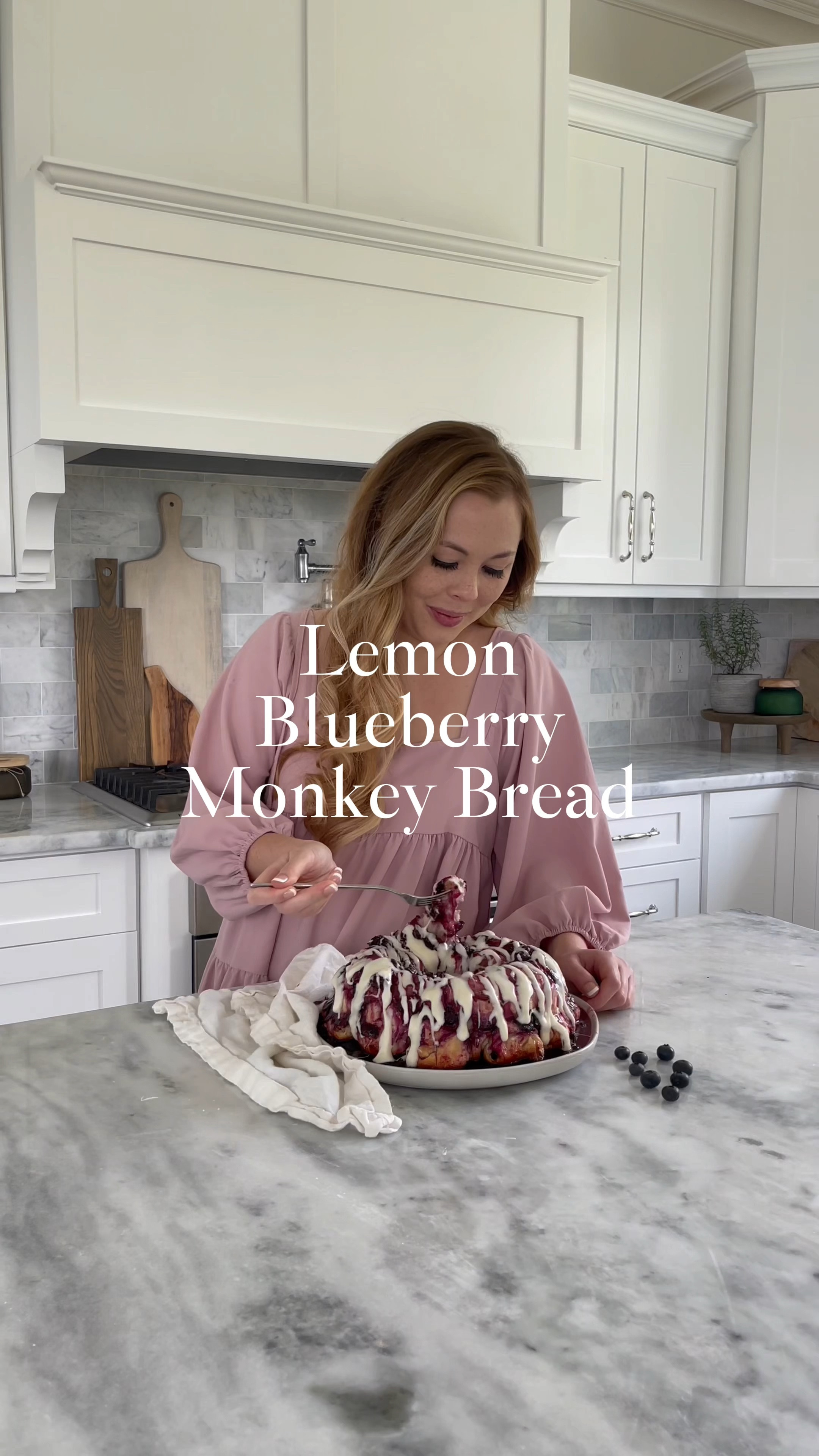 Lemon Blueberry Monkey Bread recipe: https://domesticallyblissful.com/lemon-blueberry-monkey-bread/ 
This Lemon Blueberry Monkey Bread is filled with fresh summer flavors and is a fun twist on traditional monkey bread.
But Roger was a bit hesitant when I mentioned my plan to create a lemon blueberry monkey bread.
He loves traditional monkey bread covered in cinnamon sugar goodness (with pecans too).
I reassured him that this summer twist on classic monkey bread would be just as sweet and coated in a delicious berry sauce topped with cream cheese icing.
I forged ahead and the results are positively perfect for a summertime breakfast, brunch, or dessert.
What’s your favorite type of monkey bread?

#LTKFindsUnder50 #LTKVideo #LTKSeasonal