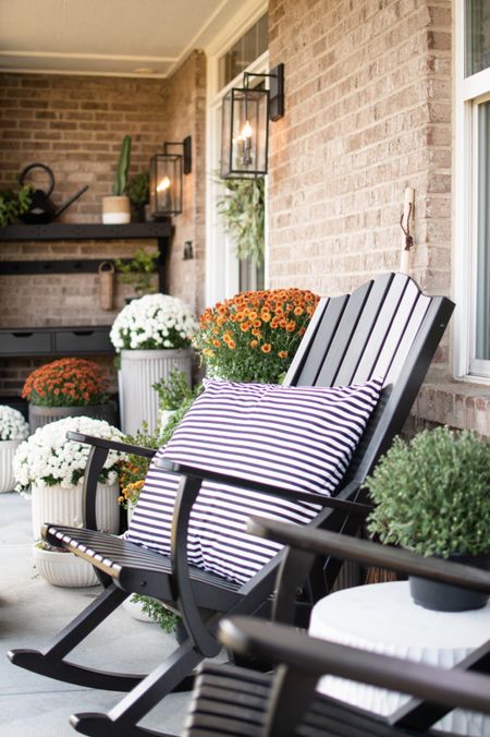 Fall front porch
End of summer porch decor
Concrete fluted planters, potting bench, Adirondack chairs, orange mums, white mums

#LTKhome #LTKSeasonal