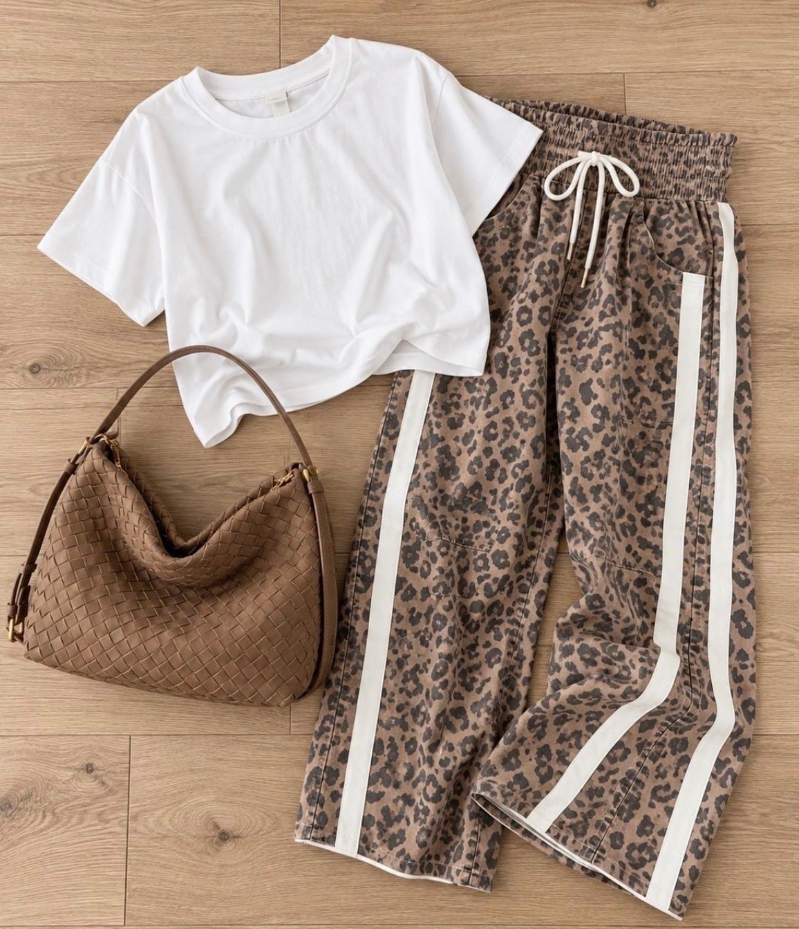 Sunday afternoon when fall is technically here, but Texas is still doing its own thing. Leopard pants, a simple tee and an easy brown bag make it feel seasonal without overheating.

warm fall outfit, Sunday outfit, leopard pants, animal print pants, casual fall outfit, white tee outfit, brown bag, transitional fall style, warm weather fall outfit, weekend outfit, fall outfit idea, JulieFranks