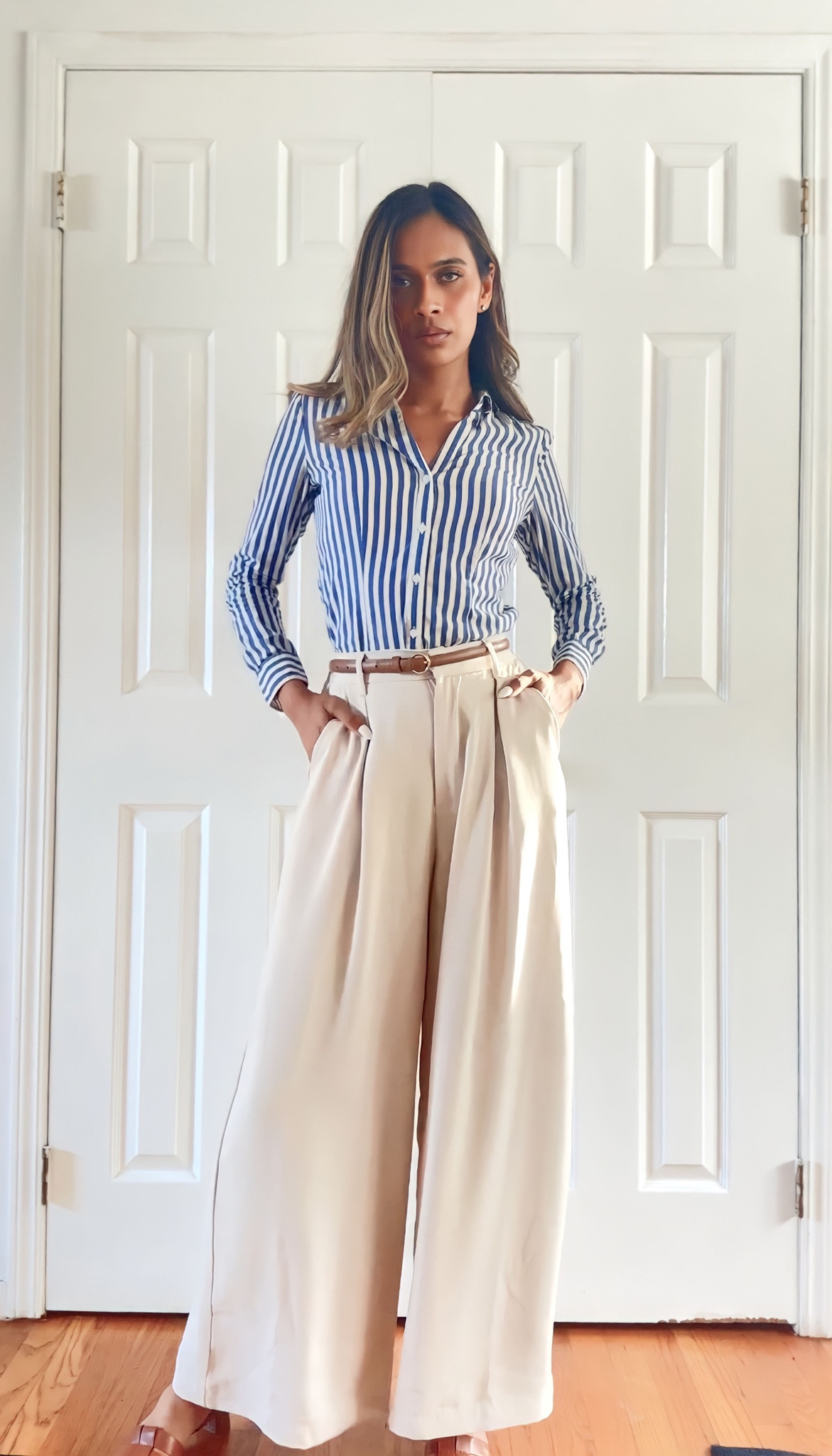 Elevate your work wardrobe with timeless style: Blue and white striped button-down paired with flowy beige wide-leg pants, accented by tan accessories for a sophisticated touch. 👔👖👞 #ClassicWorkwear #TimelessElegance

#LTKfindsunder100 #LTKfindsunder50 #LTKworkwear