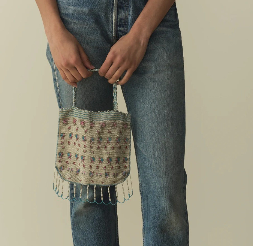 Meticulously hand-beaded by artisans in India, the DÔEN Heirloom Chiara Purse is an extra-special keepsake intended for festive occasions. Large enough to fit a small iPhone alongside other essentials, it features an intricate floral beaded design, a soft silk lining, hand-looped tassels at the bottom, and braided straps.

#LTKSeasonal #LTKFallSale #LTKItBag