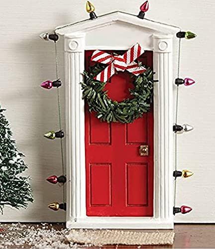 Standing miniature dimensional door surrounded with “lights” and tiny faux wreath with bow al... | Amazon (US)