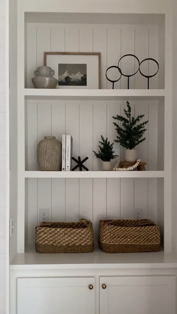Bookshelf styling. Holiday decor. Holiday styling. Family room decor. Shelf styling. Home decor. Neutral decor. Juniper print shop. Art. Wall Art. Vase. Basket.

#LTKhome