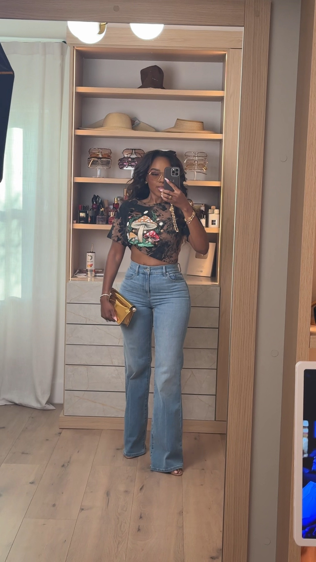 Hi babes! 🤎

Okay this graphic crop + denim combo is SUCH a fun switch-up from basic everyday outfits while still being insanely wearable. The vintage-inspired mushroom graphic gives it that cool-girl edge, and pairing it with classic light wash denim keeps the whole look balanced and easy to style.

This is the kind of outfit that looks effortless but still feels styled because the accessories completely elevate it. Added the metallic clutch + layered jewelry to bring in that luxury-inspired contrast and make the casual pieces feel way more elevated.

A statement tee styled with good denim is always worth buying because you can rotate it with cargos, leather pants, shorts, skirts, or blazers year-round. Cost per wear on pieces like this ends up being SO good.

Where to wear this:
• Concert nights
• Casual dinner dates
• Weekend errands
• Girls night
• Casual drinks
• Travel days
• Everyday summer outfits

Everything is linked below ✨

xx Kira | IG: KirasFashionFinds

5’4 | 140LBS | 34D-27-40 | size small | jeans 27