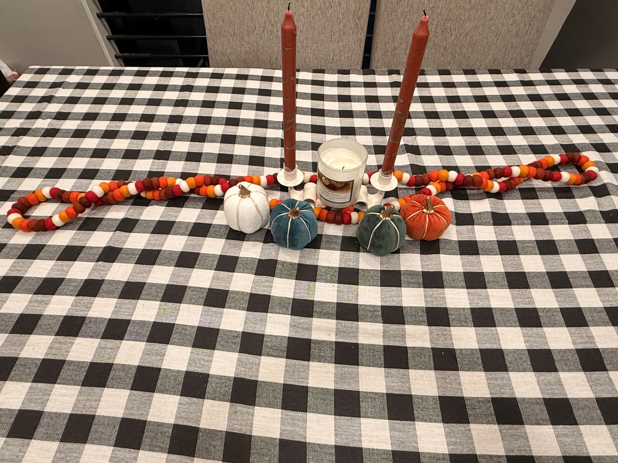 First fall decor of the season. 

Loving the fall colors against the buffalo plaid tablecloth. I added some pumpkins for even more color. 

#LTKHome #LTKSeasonal #LTKHalloween