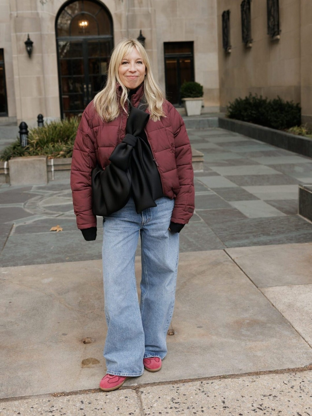 Baggy jeans with sneakers is by far my easiest, casual winter outfit. The best sneakers with baggy jeans are sleek, low-profile sneakers, rather than chunky, Dad-like sneakers. You want sneakers that almost have a ballet flat vibe – these are the kind that let the baggy jean hems breathe and offer the right kind of balance.

Because it’s winter, I strongly prefer sneakers that are suede, in deeper jewel tones. The extra texture and rich color seems to hold their own better against thick, cozy knits and warm jackets. 