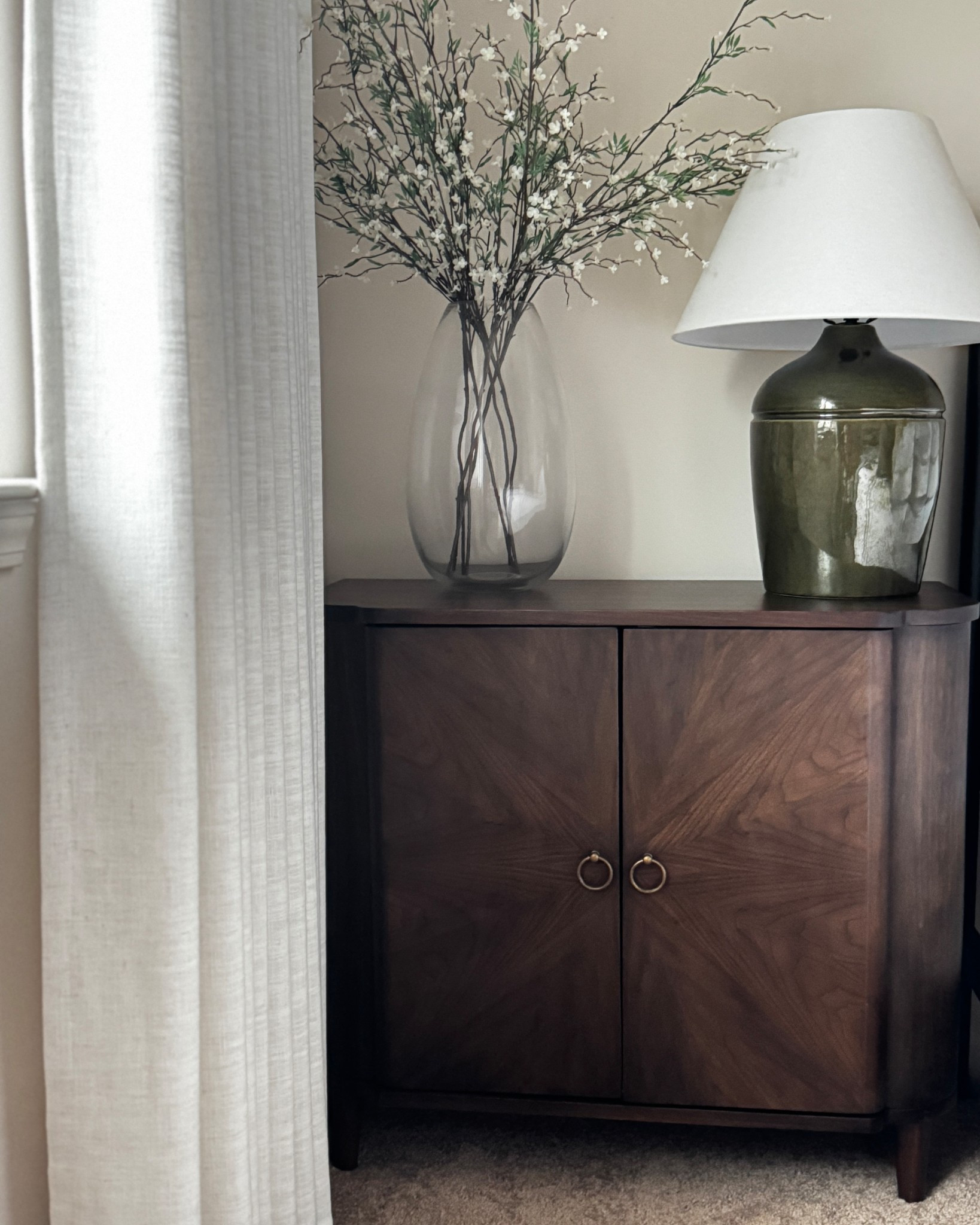 So many ways to style this beautiful Threshold cabinet designed with Studio McGee from Target. 

I added a large vase from West Elm alongside a green Threshold table lamp designed with Studio McGee. The TwoPages linen curtains add softness to the room  

All 3 pieces are beautiful and can be used anywhere in your home. 
#nightstandstyling #endtablestyling 

#LTKHome #LTKstorytime