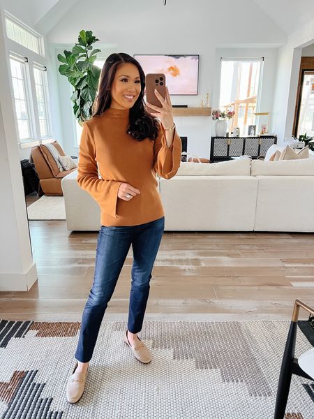 Fall outfit with a Burnt orange mockneck sweater with flare sleeves made of a synthetic blend. Wearing size XS. Pairing with straight leg high rise jeans in a dark wash. Wearing size 25  

#LTKsalealert #LTKxNSale