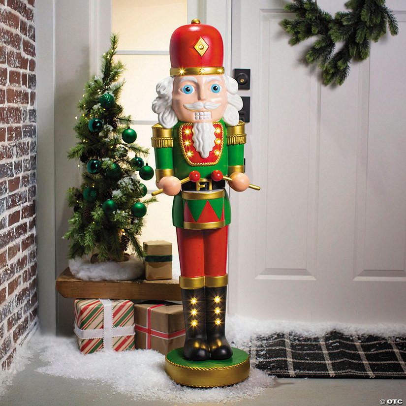 4 Ft. Light-Up Nutcracker with Drumsticks Christmas Decoration | Oriental Trading Company
