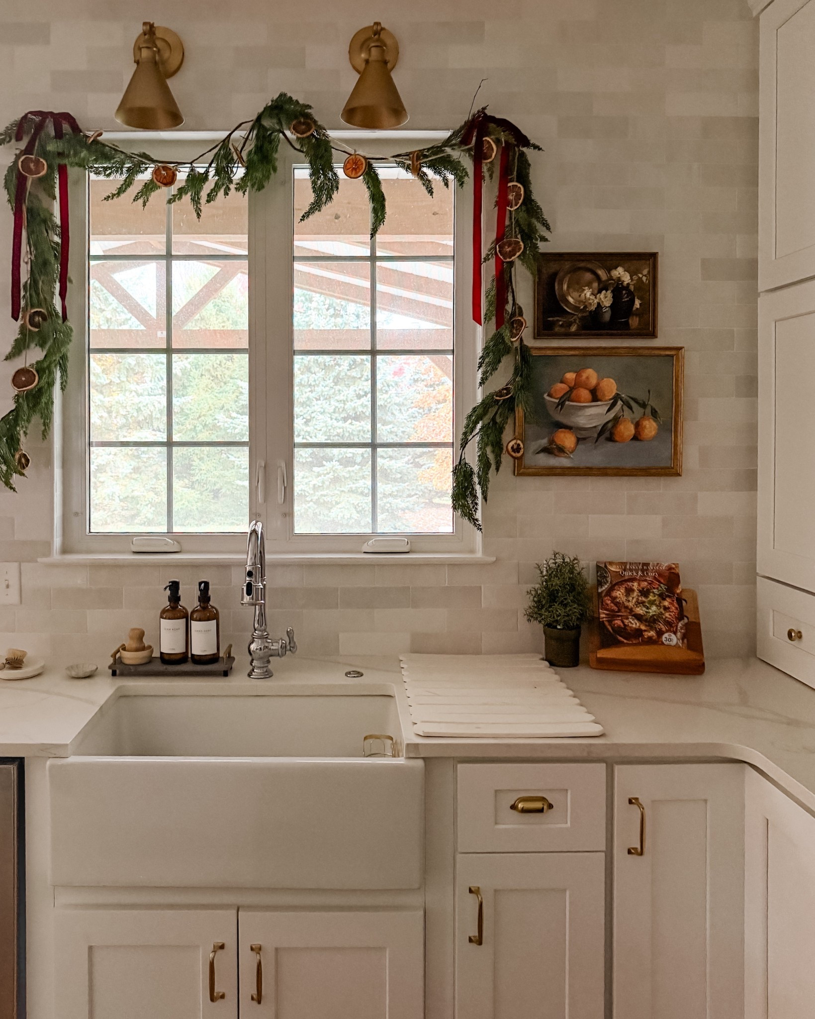 Big fan of kitchen window garland. This sparse look is two strands of cedar garland from Amazon. Oranges were a DIY project from a few years ago! 

#LTKHoliday #LTKFindsUnder50 #LTKHome