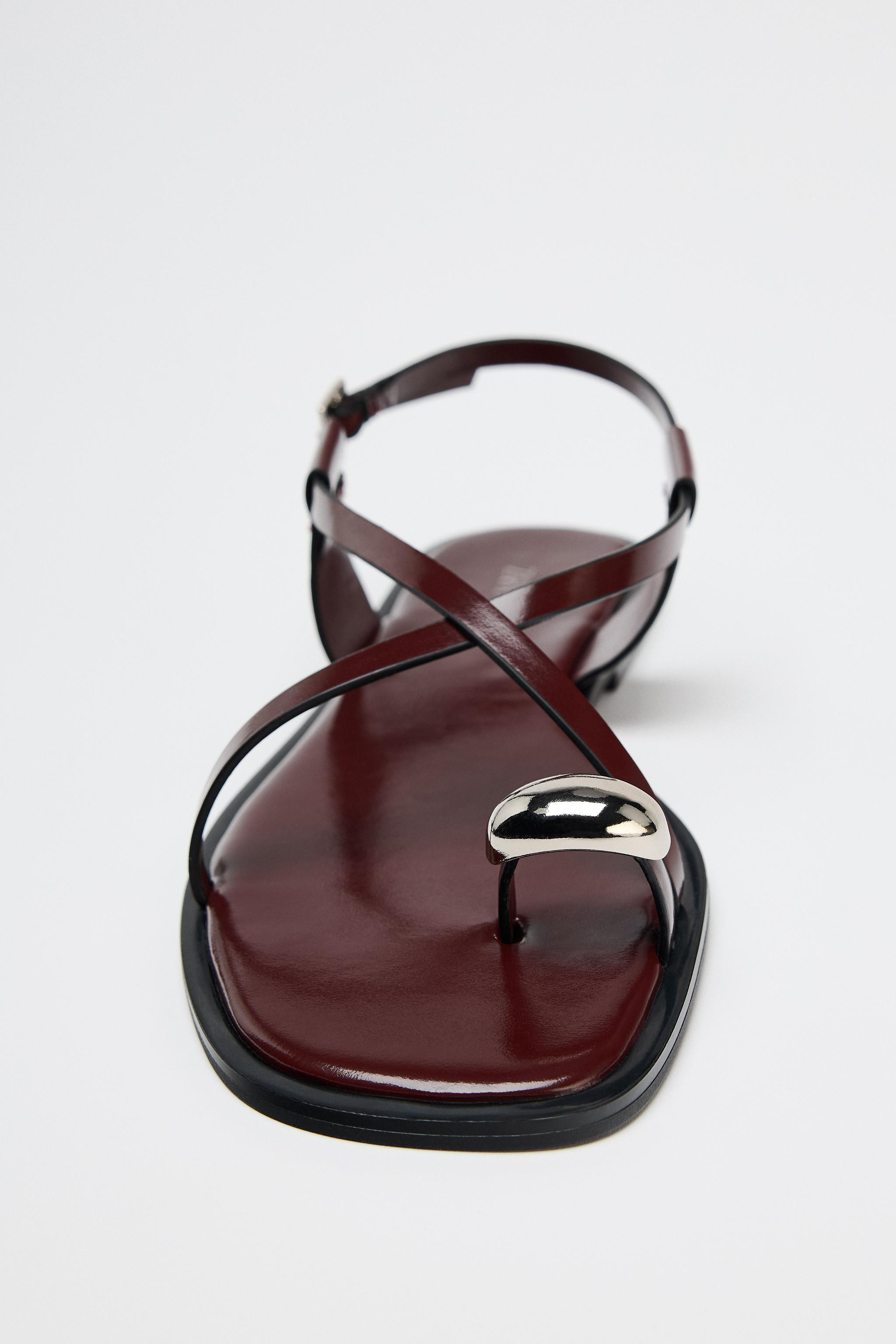 Flat sandals with thin straps and metal embellishment at toe. Buckle closure. Sole height: 0.6 in... | Zara US