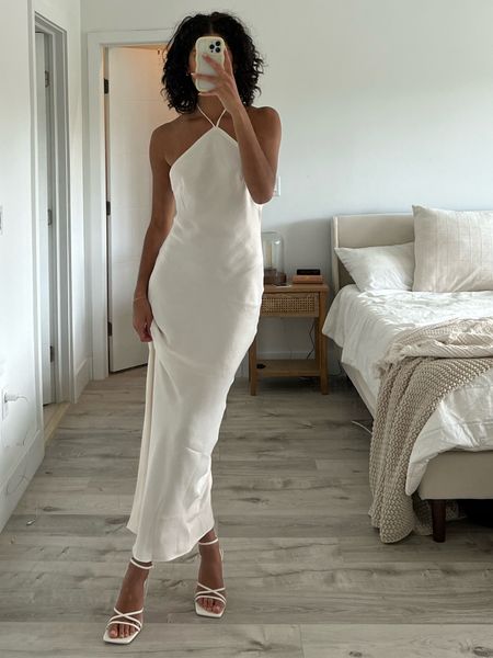 engagement party dress option 👰🏽‍♀️💍🤍

Midi satin high neck white dress : revolve
white strappy heels: zara (sold out)