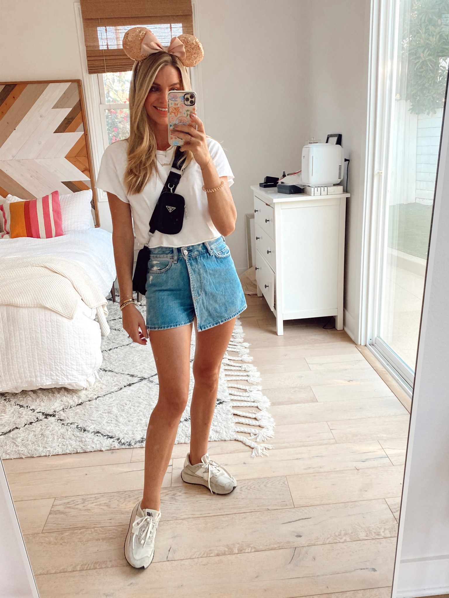 Denim skort and new balances. Causal look for Disneyland  

#LTKunder100 #LTKstyletip #LTKshoecrush