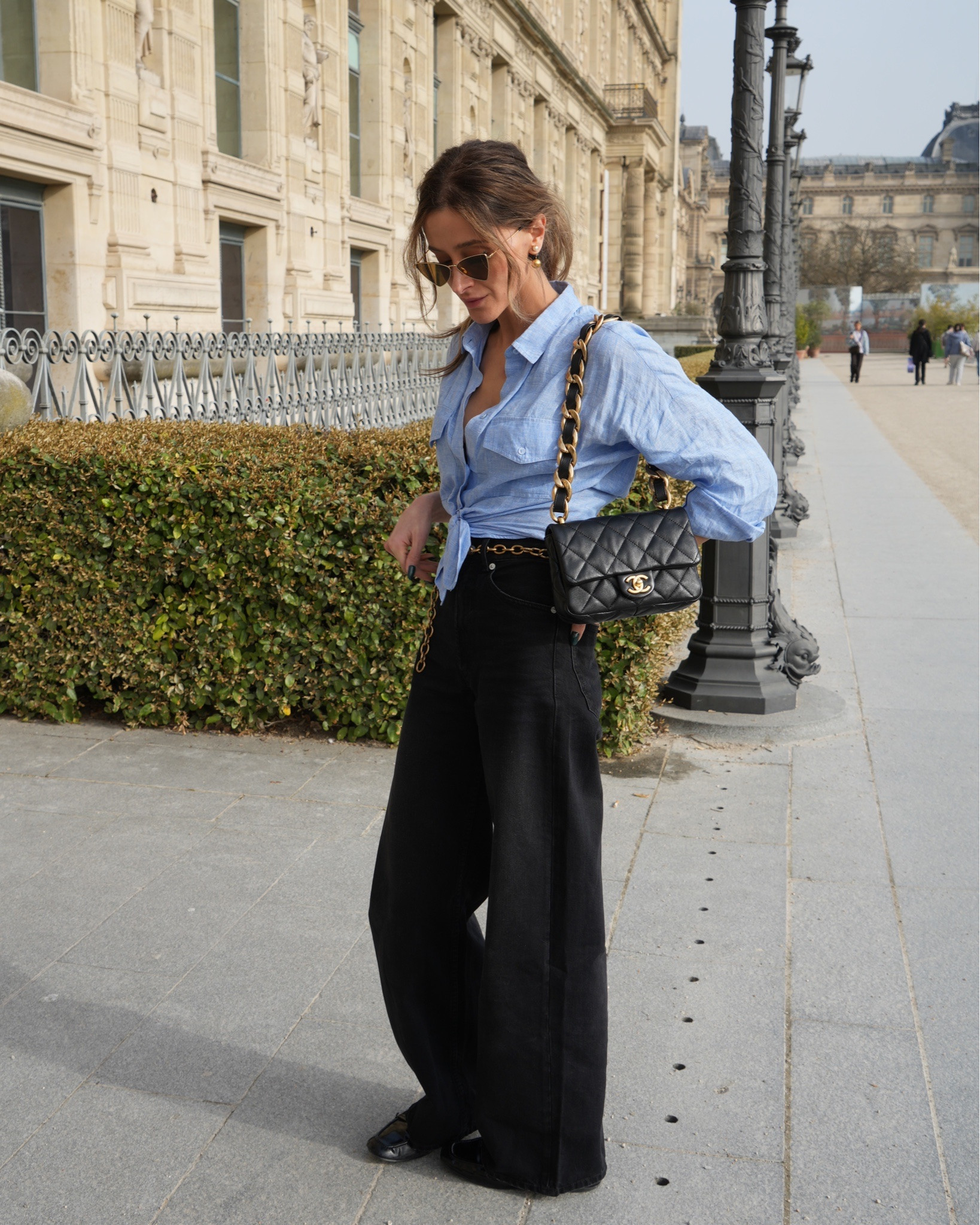 Classic Paris styling with my vintage Chanel flap bag, wide-leg black trousers, and a light blue tied shirt in the Louvre gardens.

#LTKfrance #LTKspring #LTKworkwear