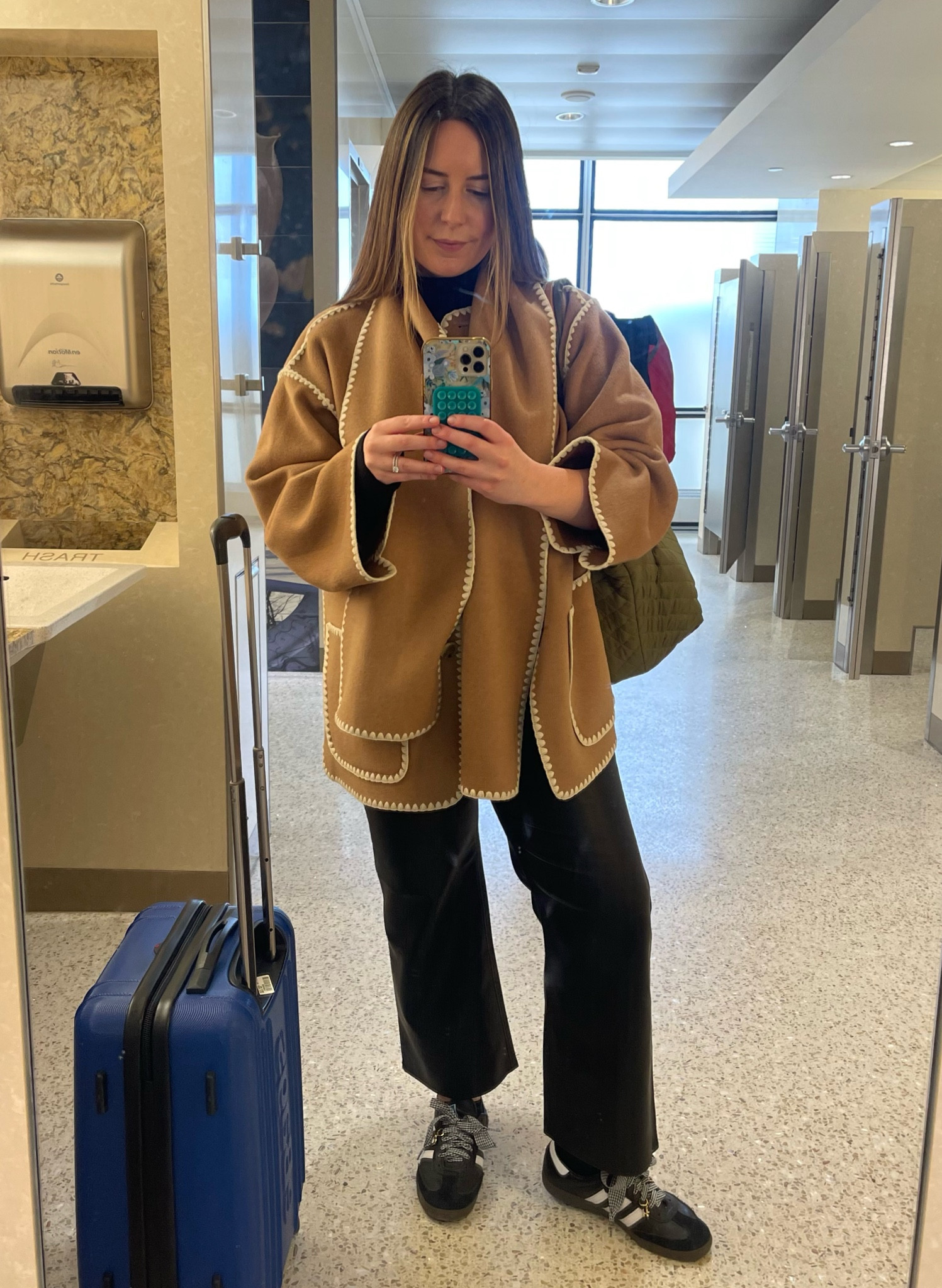 MSP ➡️ DFW for the LTK 2025 Kickoff!! Wearing faux leather pants and a fun sweater for team meetings and happy hour with Product Design & Creative today. 

#LTKTravel #LTKWorkwear
