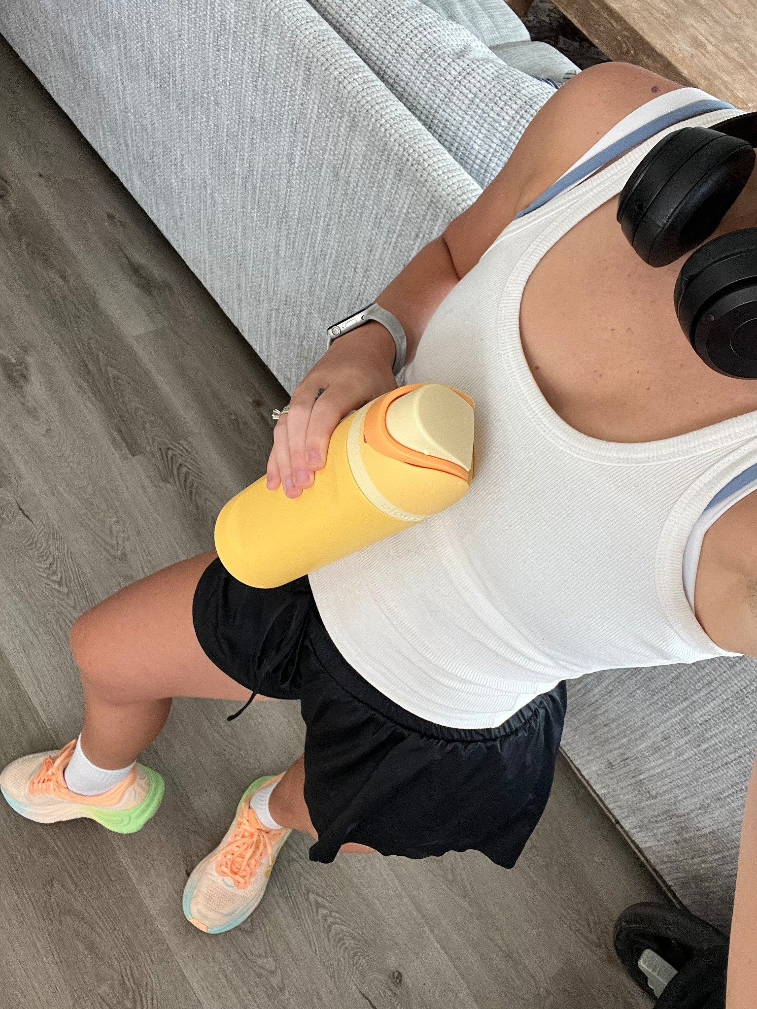 My go-to running & walking outfit lately 🤍☀️ This white Free People tank is light, breathable, and layers perfectly over my fave Amazon sports bra + comfy shorts. Wearing my HOKA Bondi 9s (obsessed), Beats headphones to zone in, and my Owala water bottle that goes everywhere with me. Also, don’t sleep on these no-slip running socks — total game changer. Cute, comfy, and made for movement 🏃🏻‍♀️💦

#LTKActive #LTKShoeCrush #LTKStyleTip