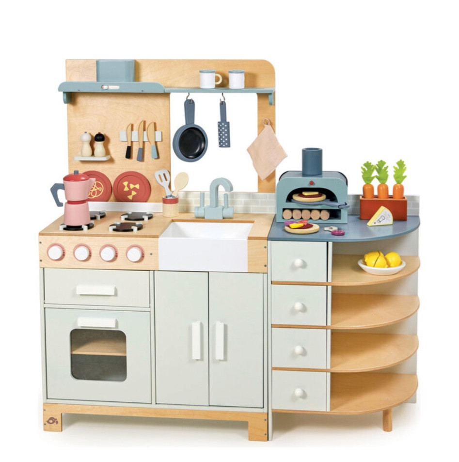 The most over the top amazing wooden kitchen for your little one! 

A two-part kitchen - sink and cooker with back board, and a storage unit with pizza oven. Unit includes oven and grill with 4 clacking buttons, and double door storage unit under the sink. Complete with lots of accessories including a pizza oven with 5 wooden logs, pizza plate, two pizza bases, two felt toppings, egg, onion, cheese, mushroom, pineapple, pepperoni, tomato, parmesan and grater, frying pan, two wooden utensils in a pot, white bowl with 3 segmented lemons, 3 carrots in a planter, traditional Italian coffee pot, two cups, two decorated plates, 3 magnetic knives, salt and pepper grinders, muslin pot holder.

#woodenkitchen
#playkitchen
#woodentoys
#kitchentoy 

#LTKFamily #LTKKids #LTKBaby