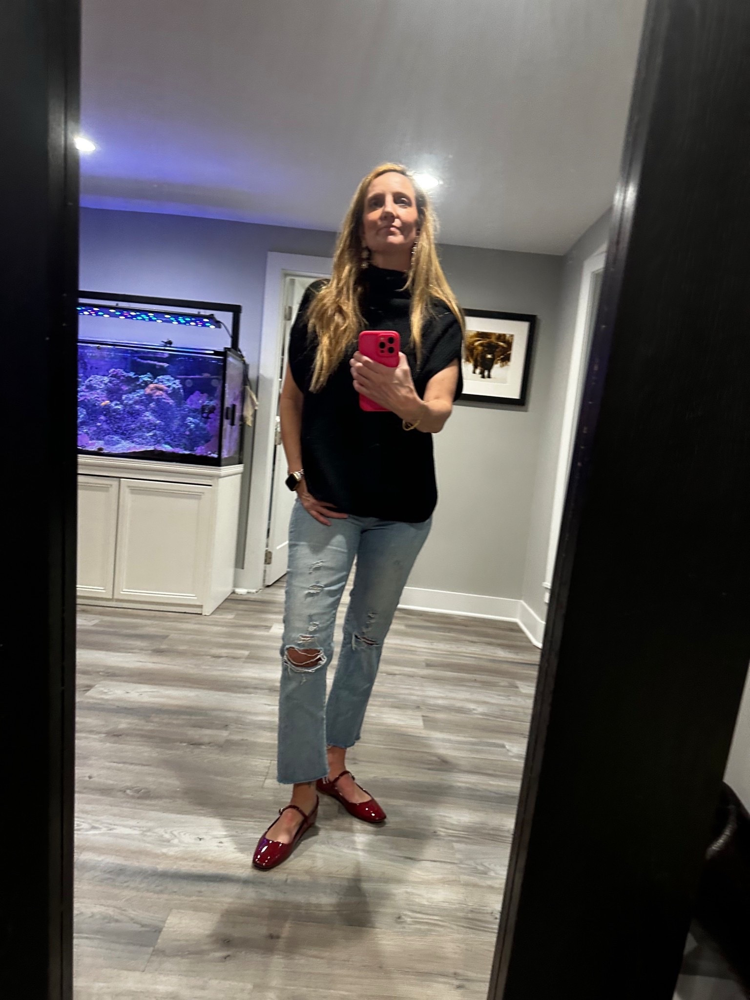 Found: The secret to elevating your favorite jeans! 🍒✨ I am loving the 'pop of red' trend right now, and these patent Mary Janes are the perfect way to wear it. I’ve paired them with a chic black high-neck top and my go-to distressed denim for a look that feels polished but effortless. It’s the ultimate cool-girl uniform! Shop my full look at the link in my bio. 👠👖

Black high neck top, sleeveless mock neck, distressed straight leg jeans, light wash denim, red Mary Jane flats, patent red shoes, pop of red trend, elevated casual outfit, chic everyday style, sleeveless knit top, ripped denim look, Parisian street style, transitional outfit, modern classic fashion, daytime date look

#PopOfRed #MaryJanes #DenimStyle #EffortlessChic #OOTD #LTKstyletip #StreetStyleInspo #CasualLuxury

#LTKActive #LTKOver40 #LTKSeasonal