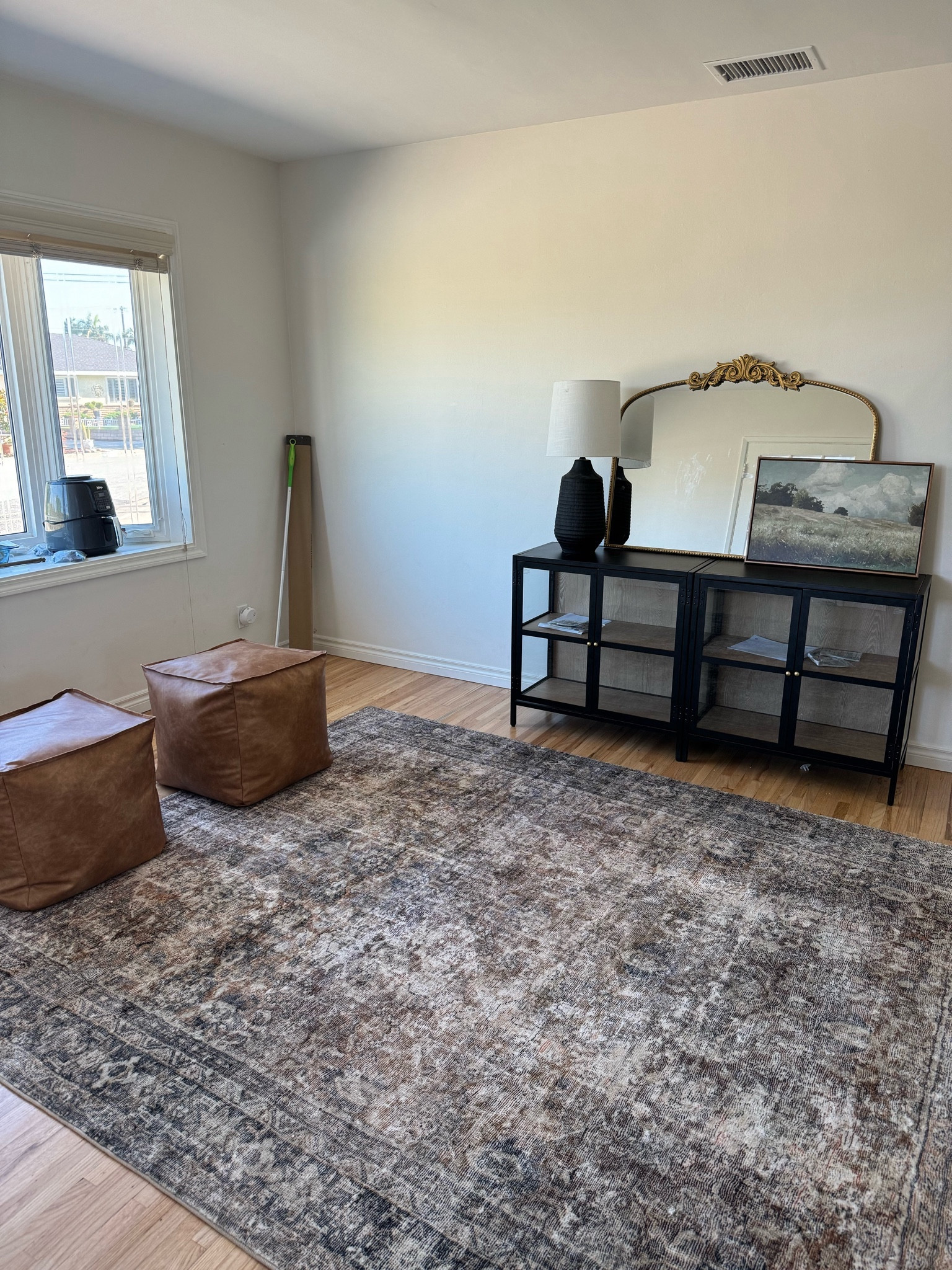 Front/Sitting Room! DETAILS: The rug is a size 7.3x9.3. The glass cabinets are the “Crystal Cove Glass Cabinet” by ThresholdxStudio McGee at Target, but they are out of stock currently. I got 2 of them and pushed them together! Lamp is old from Target  

#LTKhome