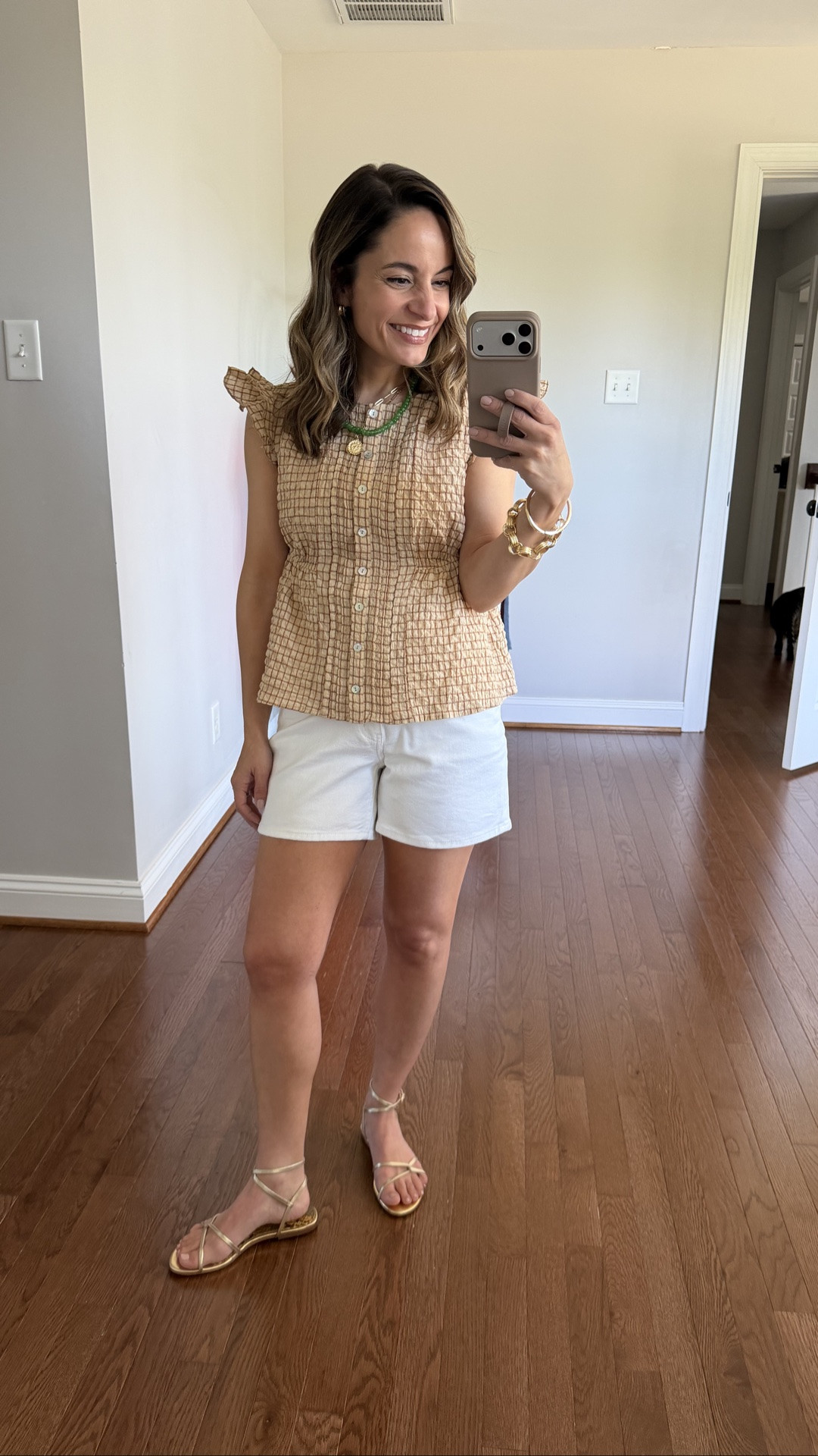 A cute summer top you don’t need to wear tucked in! 

Top (Anthropologie): xxs 
Shorts (Quince): 24 
Sandals (Sam Edelman): true to size