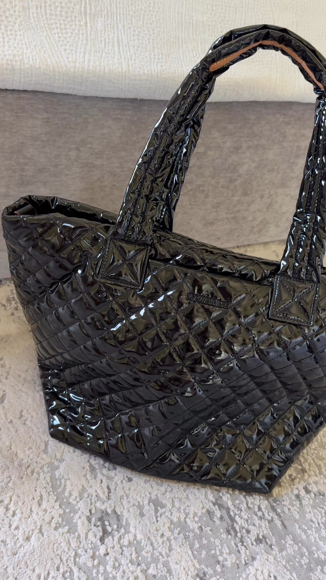 Black lacquer bags are back!  This is a popular design and available in new bag styles. 
This tote bag is one of my most used travel bags for the last 3-4 years. 
Linking similar pouches, makeup bags, in this finish. 
This exact bucket bag drawstring bag is not available, but newer styles with the black lacquer and gold combo which looks so luxe and chic  Linking new bags with gold details. 

#LTKTravel #LTKItBag #LTKOver40