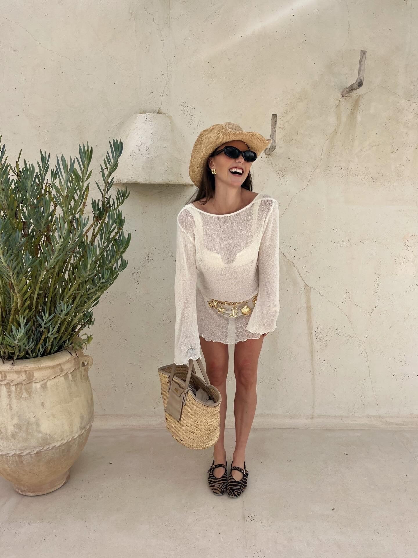 Sheer knit beach dress
Monday swimwear exuma straw beach cowboy hat
Jacquemus panier straw beach bag
Gold shell chain belt
Black oval sunglasses
Gold quilted earrings

#LTKsummer #LTKeurope #LTKtravel