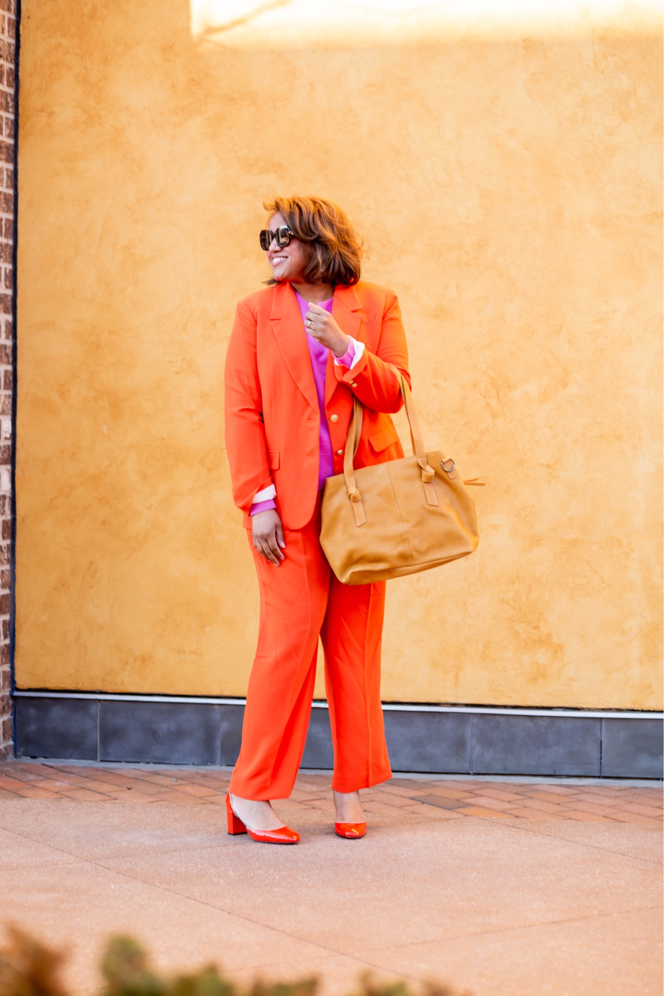 I’m totally here for this fabulous and bright @jcrew suit!  The bold orange color is amazing!  And, I love how J. Crew paired this beauty with a bright pink cashmere sweater. There are SOOO many fun ways to style this suit. It would look great with a classic white button-down (a wardrobe must in my opinion), with a graphic t-shirt, or with a striped button-down. And, the cost per wear is exceptional because the blazer can be worn with jeans, with a slip midi or pencil skirt, or with a slip midi dress. In terms of sizing, I purchased my typical size 16 in the blazer and in the pants. The pants fit slightly large in my opinion. 

I paired my suit with orange heels AND with the @sarahflint_nyc Perfect Emma in calf hair (swipe left to see a detailed shot of the shoes). Code SARAHFLINT-BARYNETTAD gets 50.00 off your first pair of SF shoes. 🧡🧡🧡🧡

My tote is from @able and it is incredible!  It’s #gifted. Code REALLYRYNETTA15 gets 15% off the tote or anything on the Able website all year! 

#LTKshoecrush #LTKworkwear #LTKstyletip