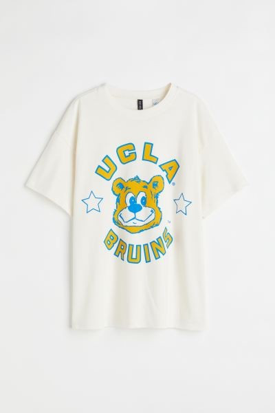 T-shirt in soft, printed cotton jersey with a round, rib-trimmed neckline, dropped shoulders and ... | H&M (UK, MY, IN, SG, PH, TW, HK)