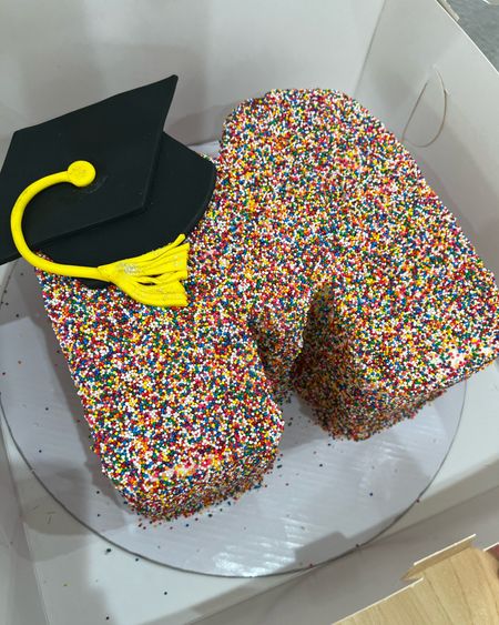 This is the cake I ordered for my daughter’s graduation. I’m not a baker but I did find letter M cake molds if you’re adventurous enough to DIY. It’s simple, sweet and festive for a high school or college graduation. I also linked similar rainbow nonpareil sprinkles and a fondant mold to create the graduation cap and tassel. 

#LTKfamily #LTKU #LTKhome