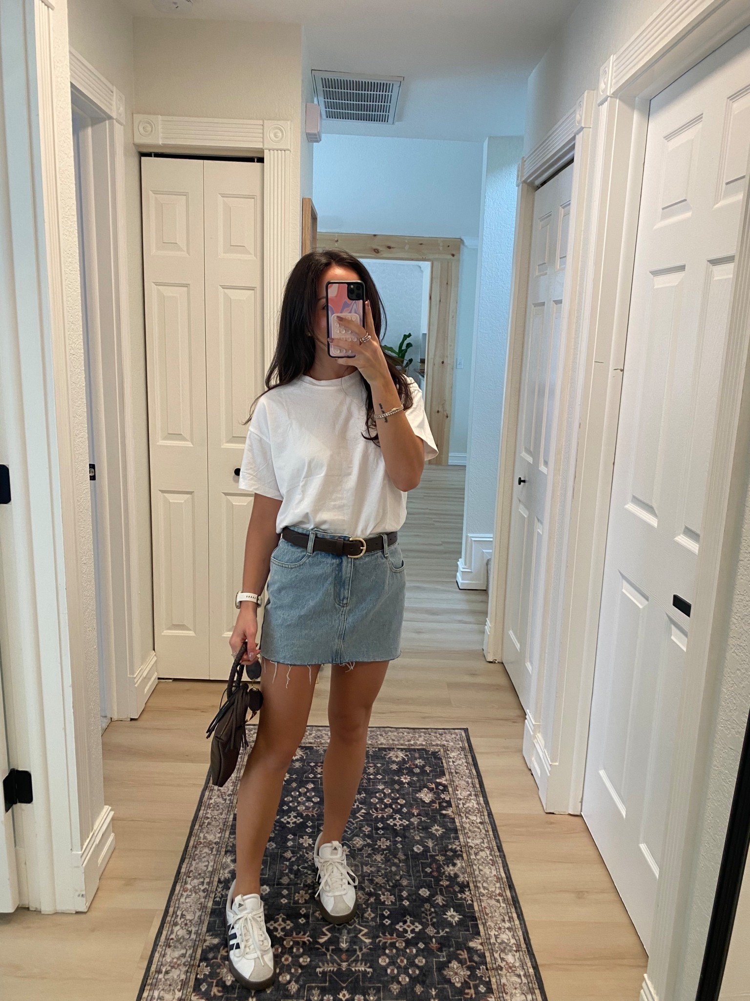 Fall transition outfit in florida! Denim skirt with oversized white boxy tee and adidas sneakers 

#LTKSeasonal #LTKStyleTip #LTKFindsUnder50